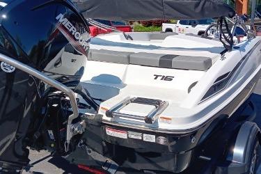 2026 Tahoe T16 boat with Mercury engine, docked outdoors.