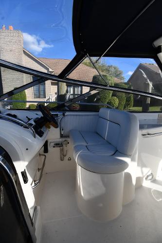 1997 Sunseeker Camargue 47 cockpit with white seating and steering, outdoor view.