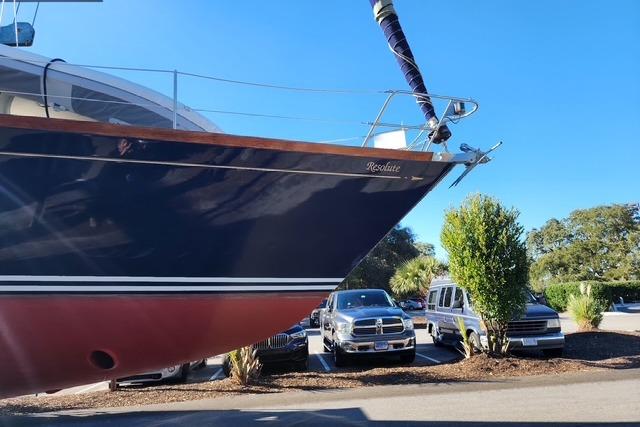 1984 Bristol 45.5 Center Cockpit yacht in parking lot, blue hull, sunny day.