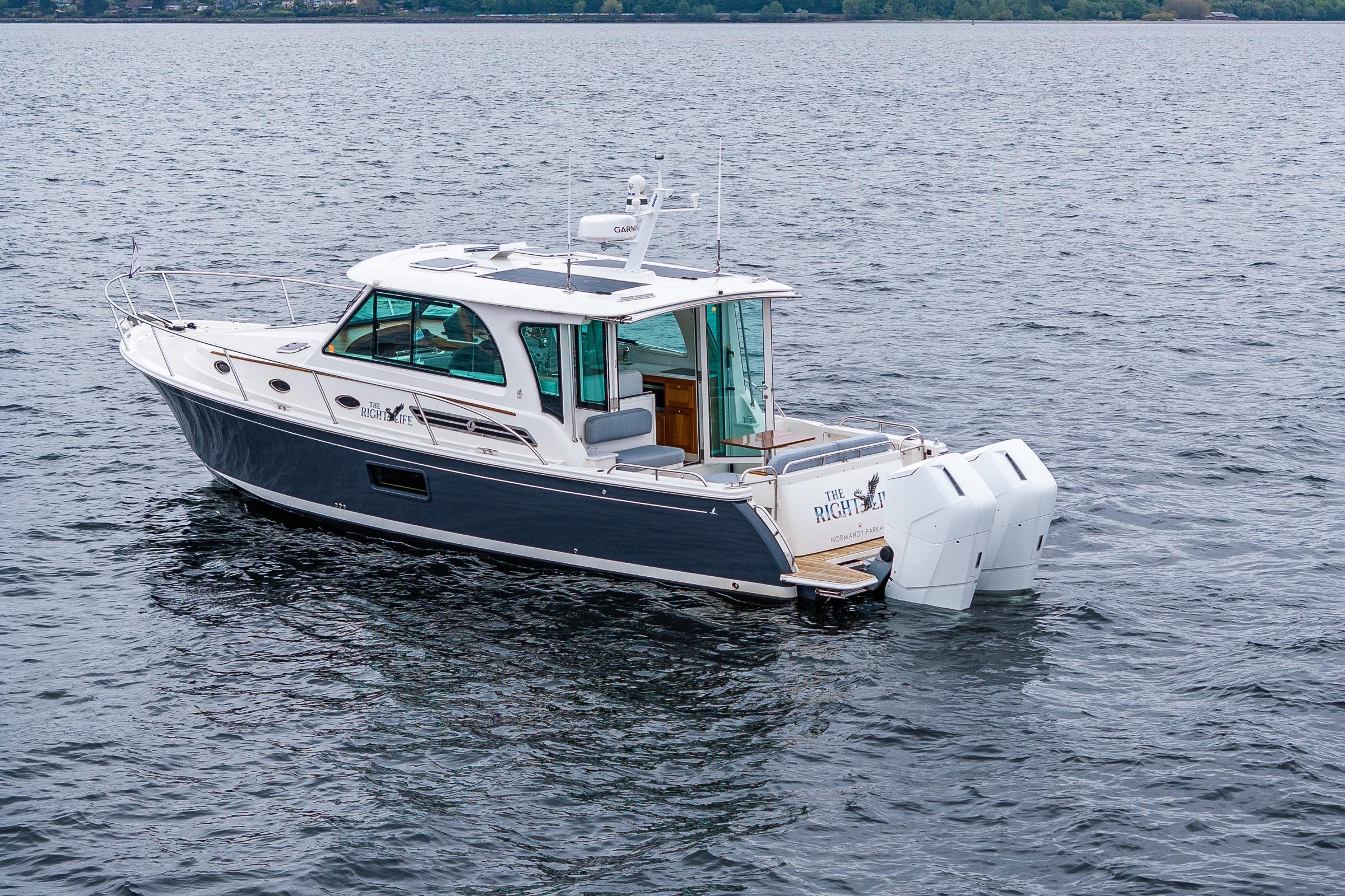 2025 Back Cove 39O boat on open water, showcasing sleek design and powerful engines.