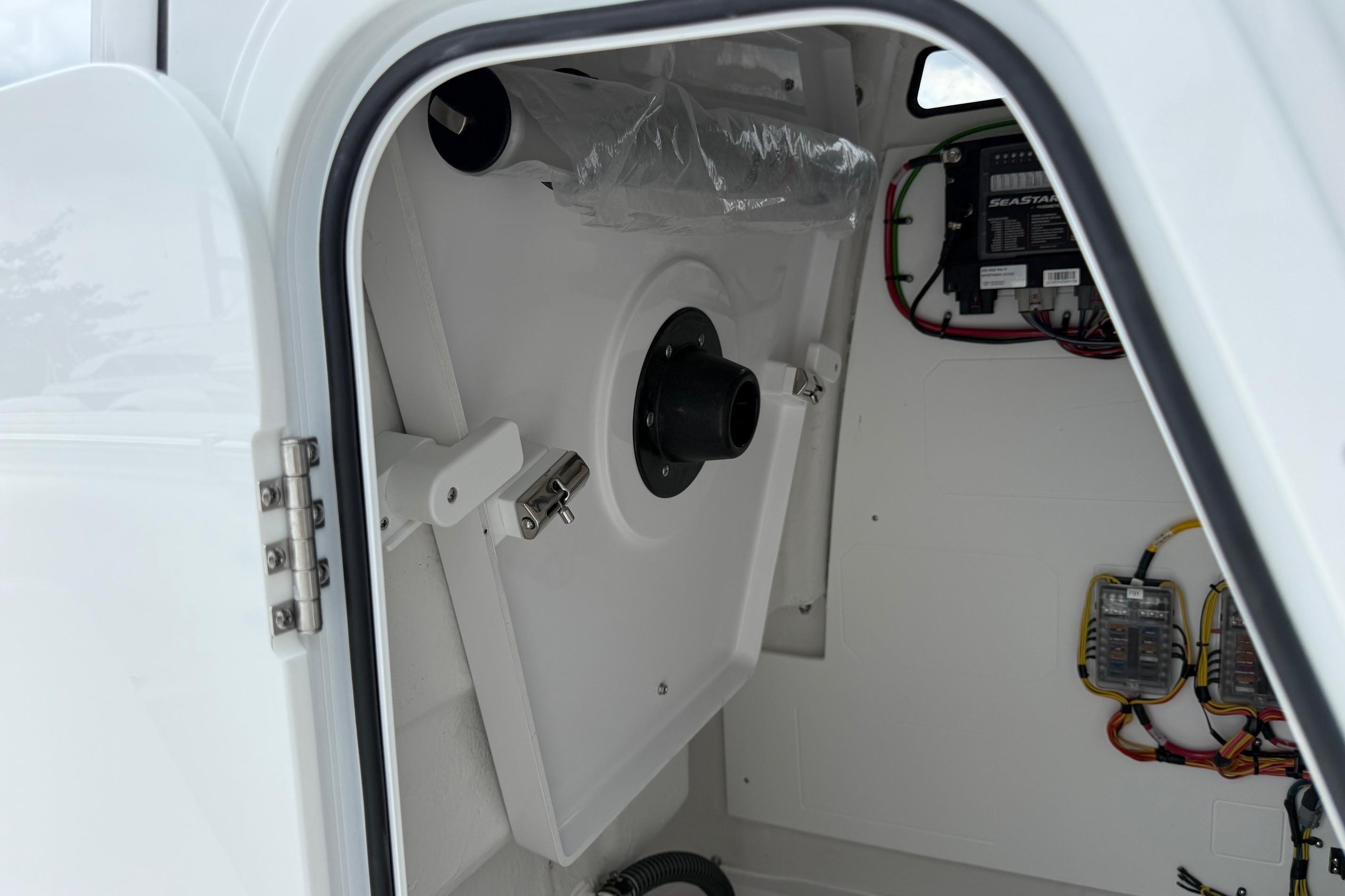 Interior view of 2026 Sportsman Heritage 231 Center Console boat's storage compartment.