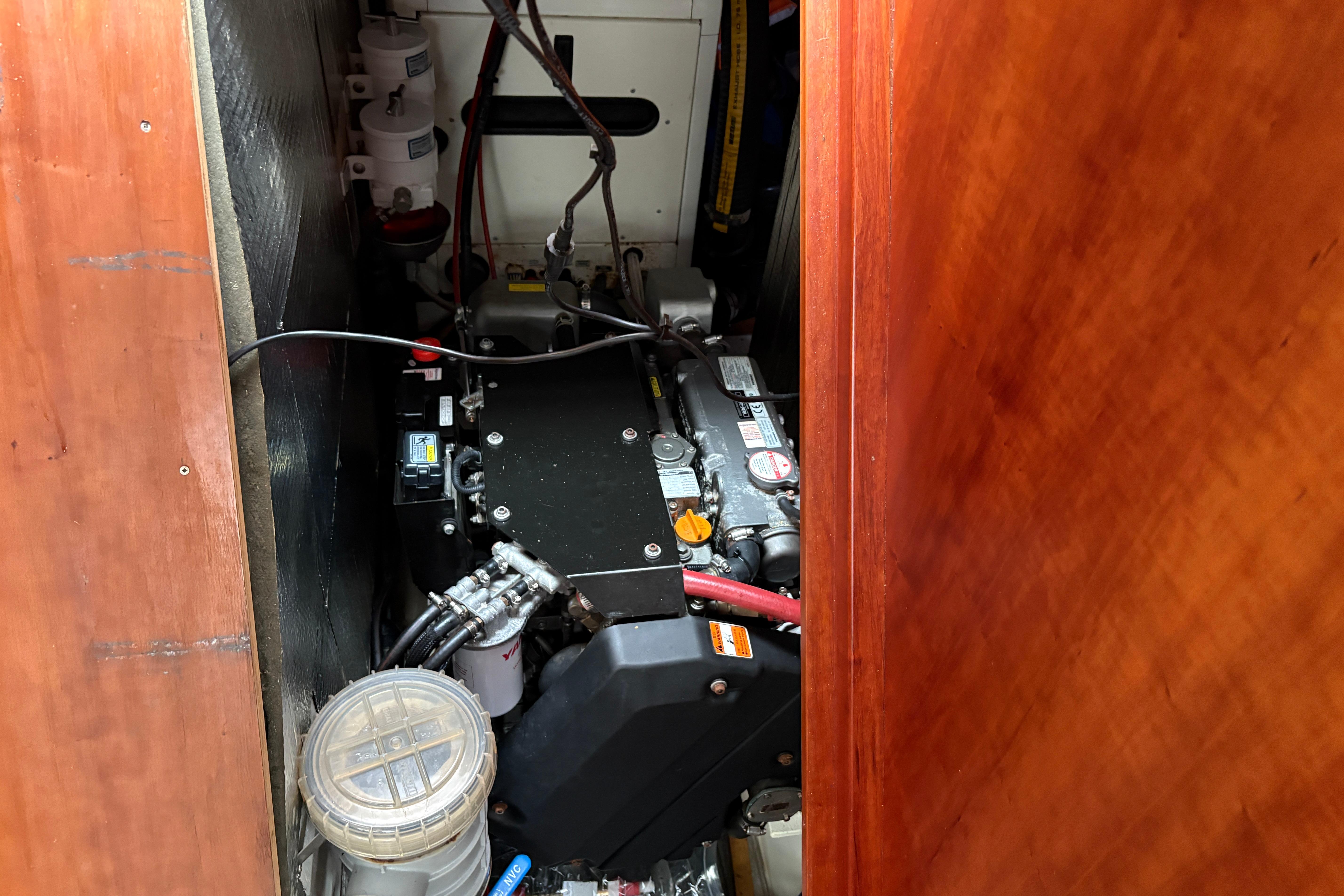 Engine compartment of 2019 Chatam Extreme 42 yacht, showcasing mechanical components and wiring.