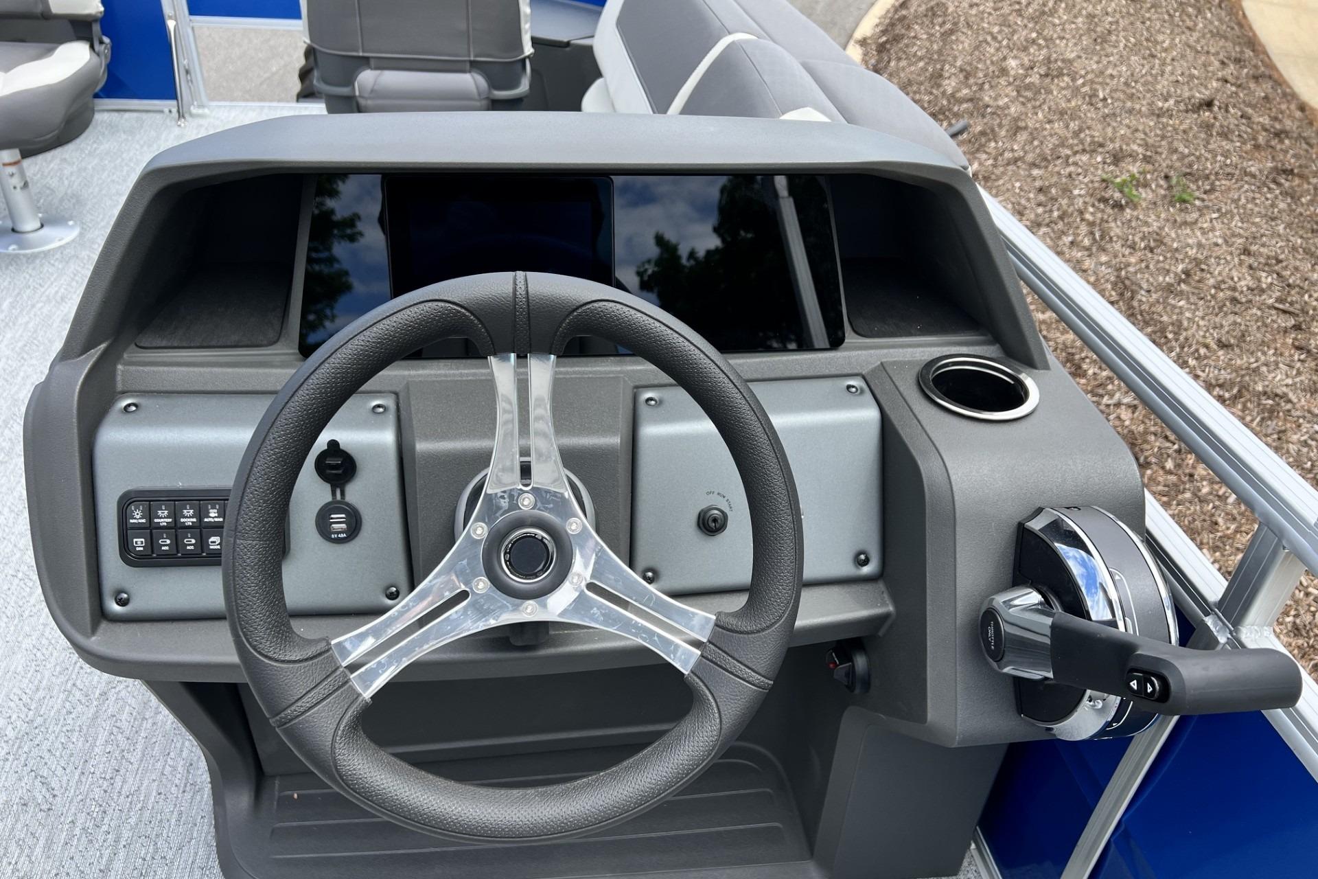 Steering console of 2026 Sun Tracker Fishin' Barge 20 DLX pontoon boat.