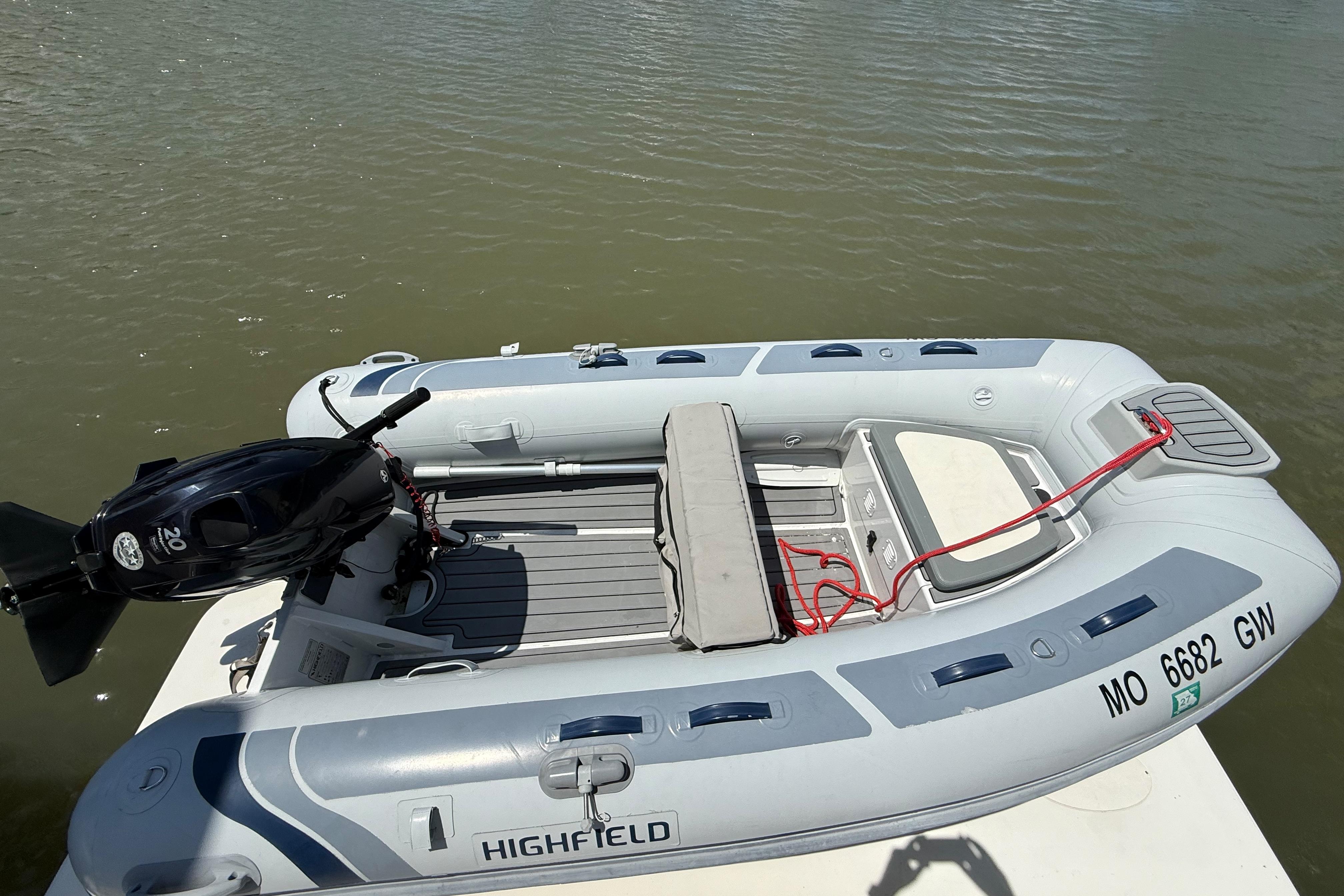 Inflatable boat with outboard motor on water, associated with 2006 Carver 43 Motor Yacht.