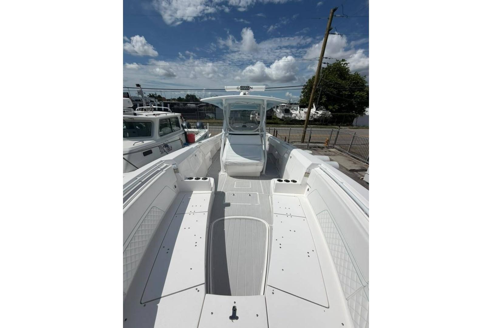 2020 Intrepid 375 Nomad SE boat with spacious deck under a clear blue sky.