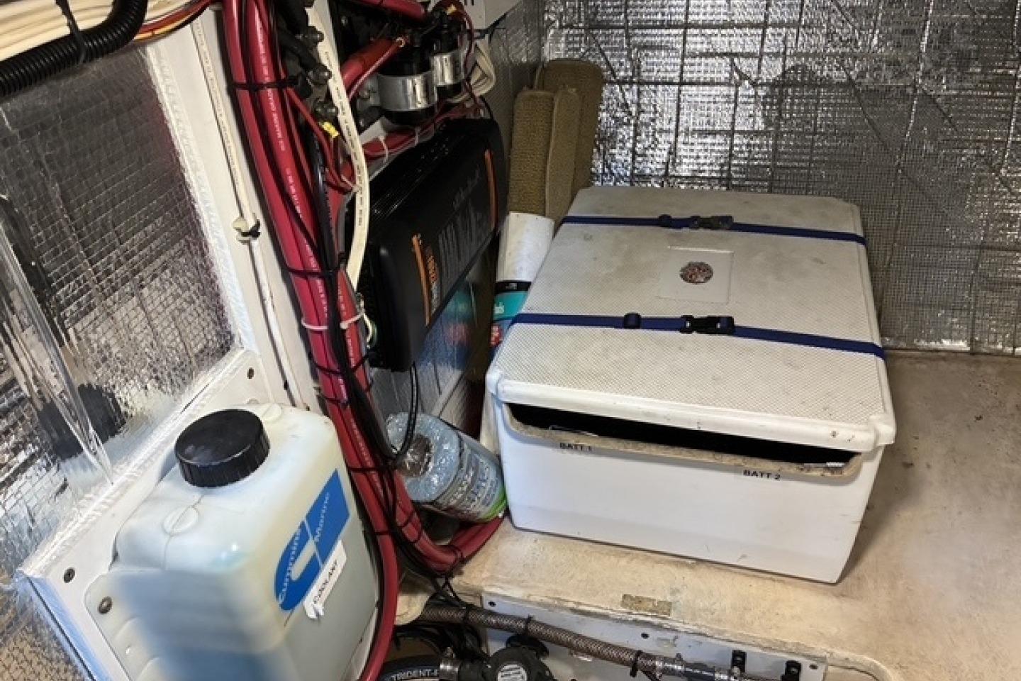 Engine room of a 2000 Nordic Tug 37 with wiring and equipment.