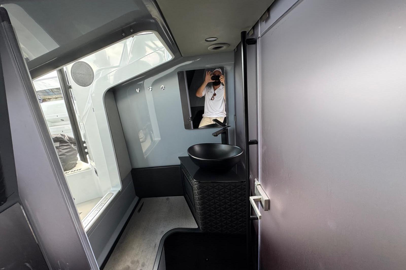 Interior of 2023 BRABUS Shadow 900 ST, featuring sleek modern design and black basin.