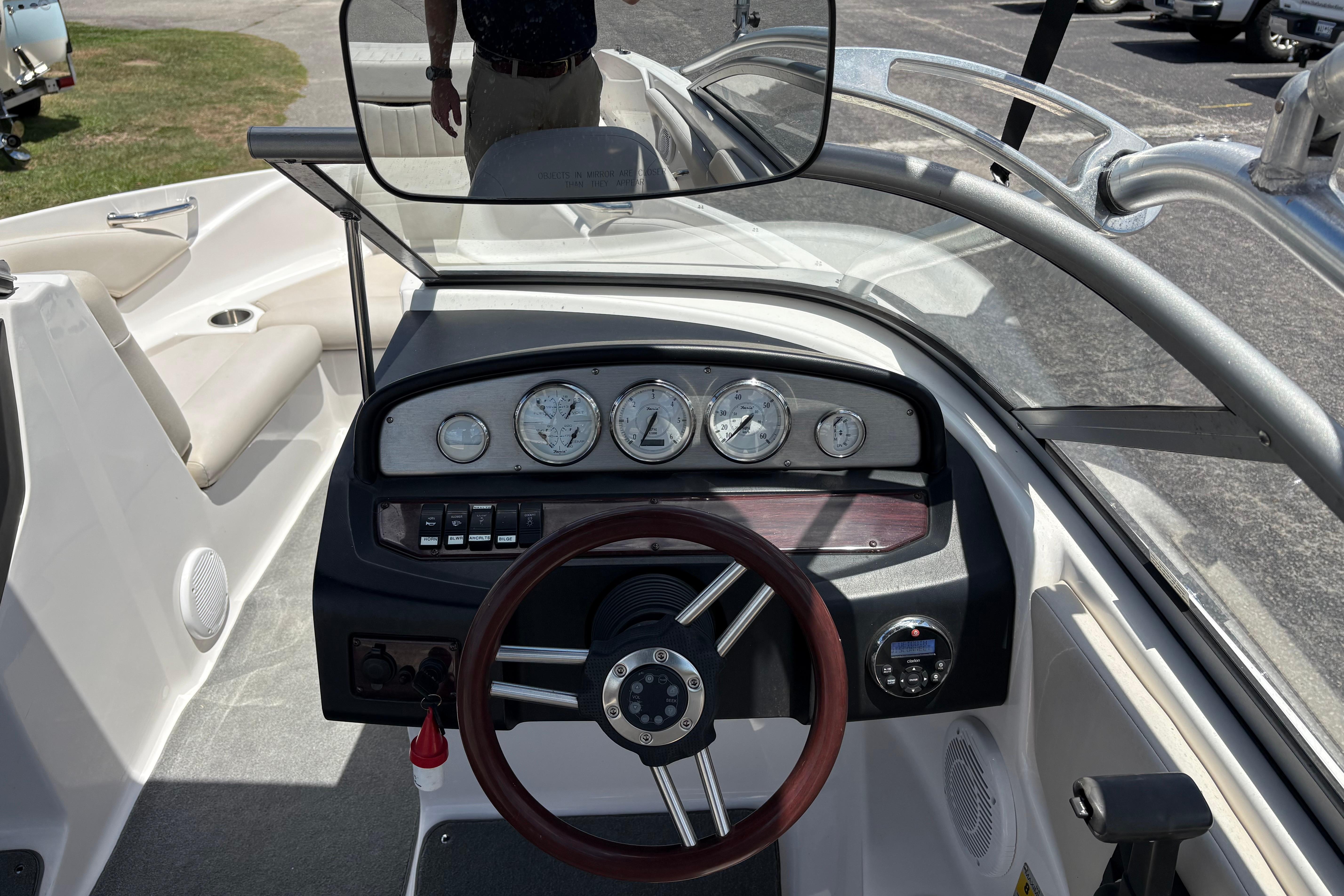 2008 Regal 1900 Bowrider dashboard with gauges and steering wheel, showcasing interior design.