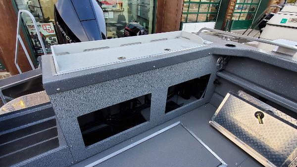 2023 Spartan 220 Maximus boat interior with storage compartments and modern design.