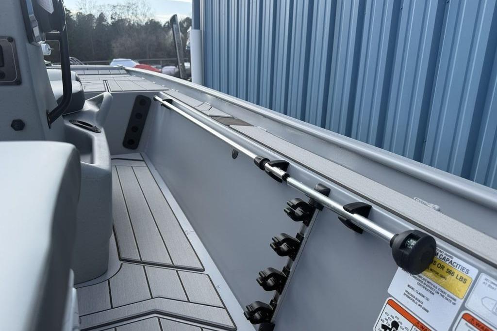 2026 Tracker Bass Tracker Classic CC boat interior with rod holders and sleek design.