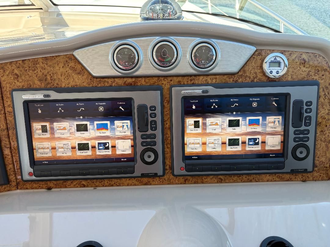 The image shows the dashboard of a 2011 Formula 45 with two large screens and several gauges.