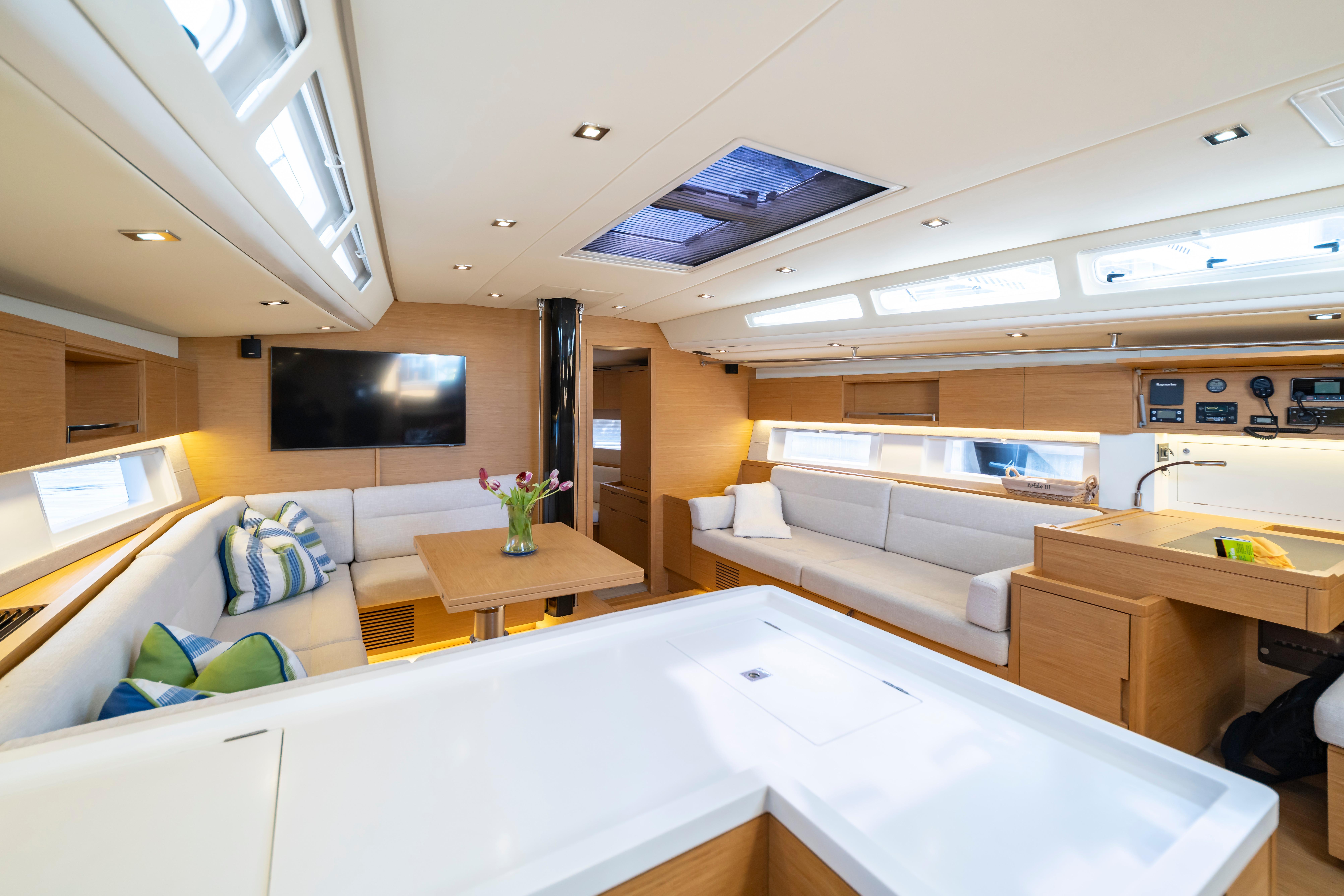 Luxurious interior of 2016 Grand Soleil 58 yacht with modern furnishings and ample natural light.