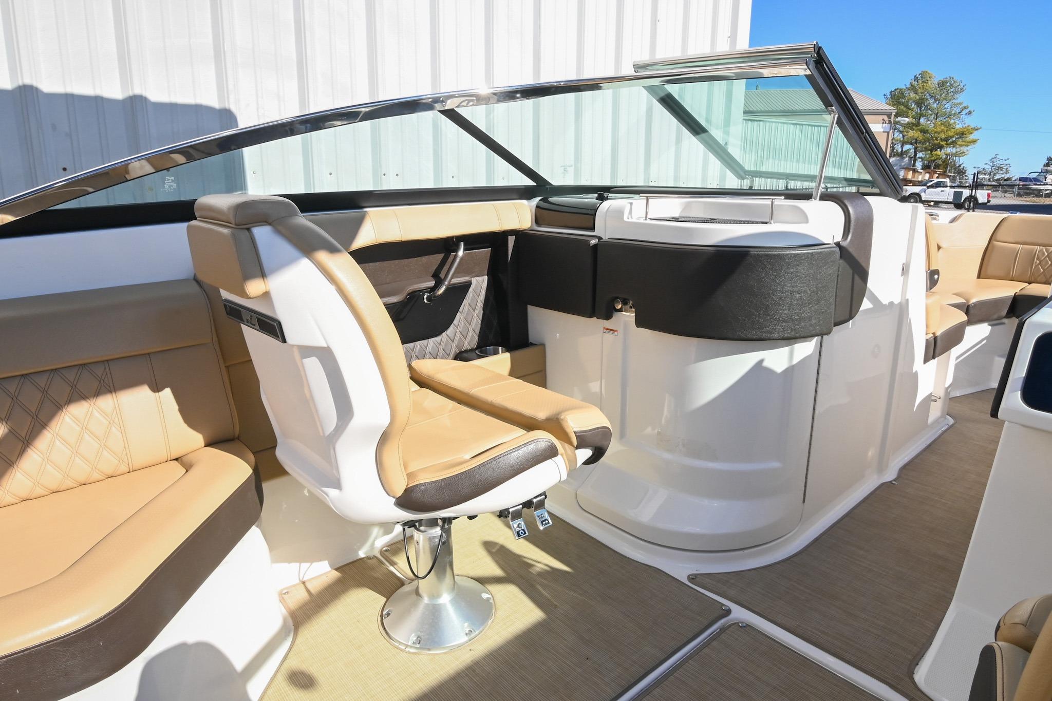 2020 Sea Ray SLX 250 boat interior with tan seating and modern design.
