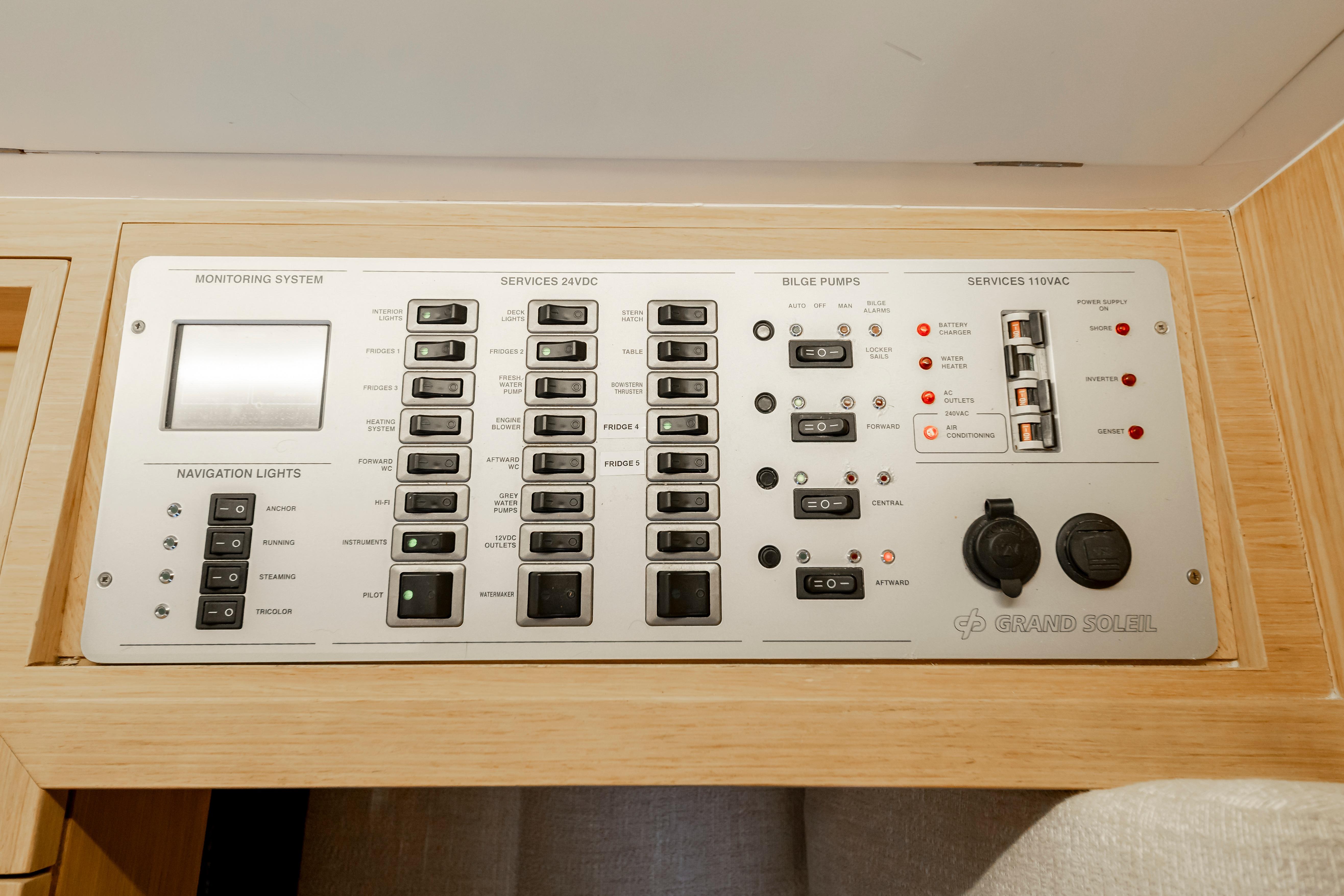 Control panel of a 2016 Grand Soleil 58 yacht, featuring navigation and monitoring systems.