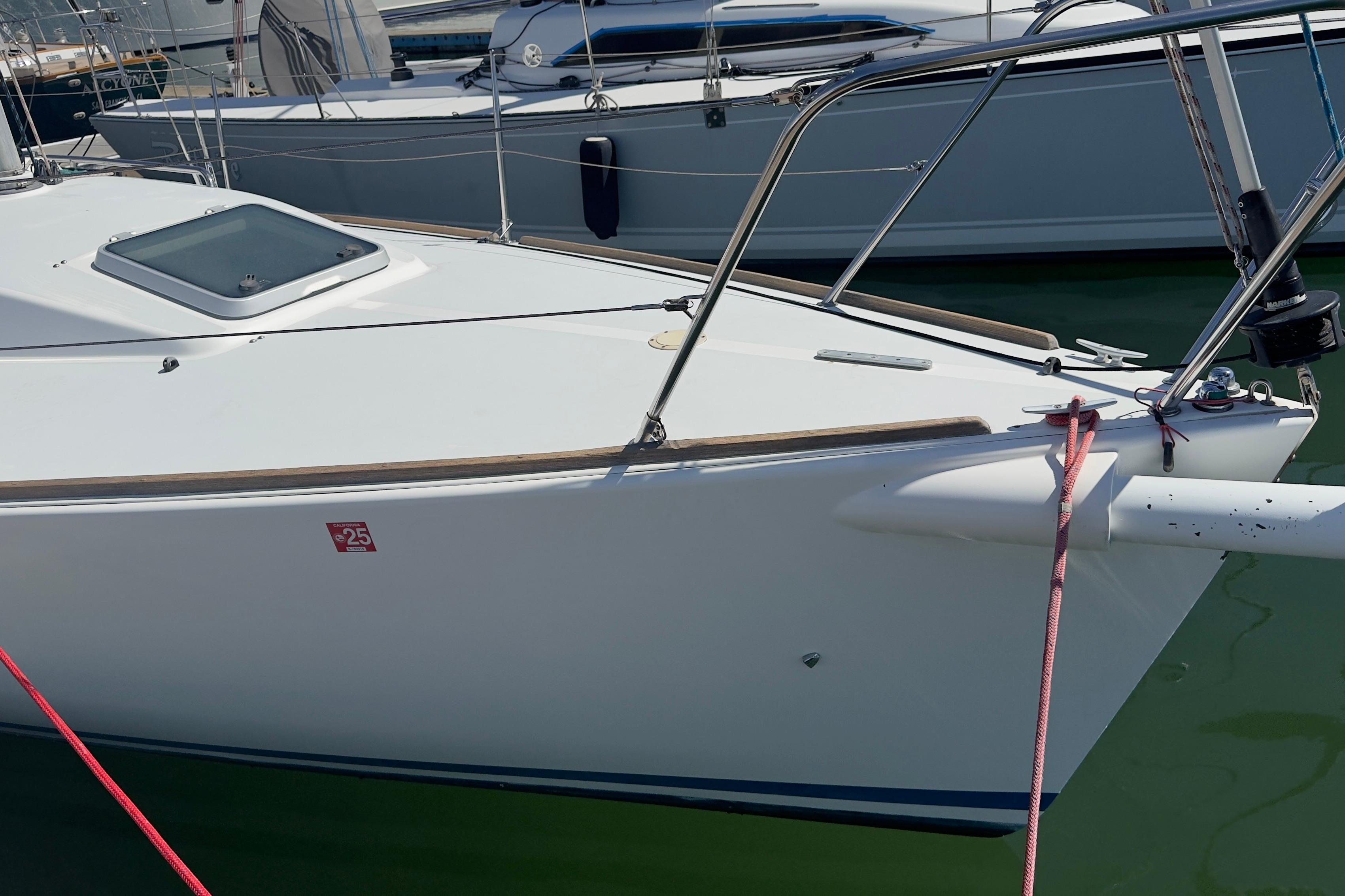 1994 J Boats J/92 sailboat docked, featuring sleek white hull and deck details.