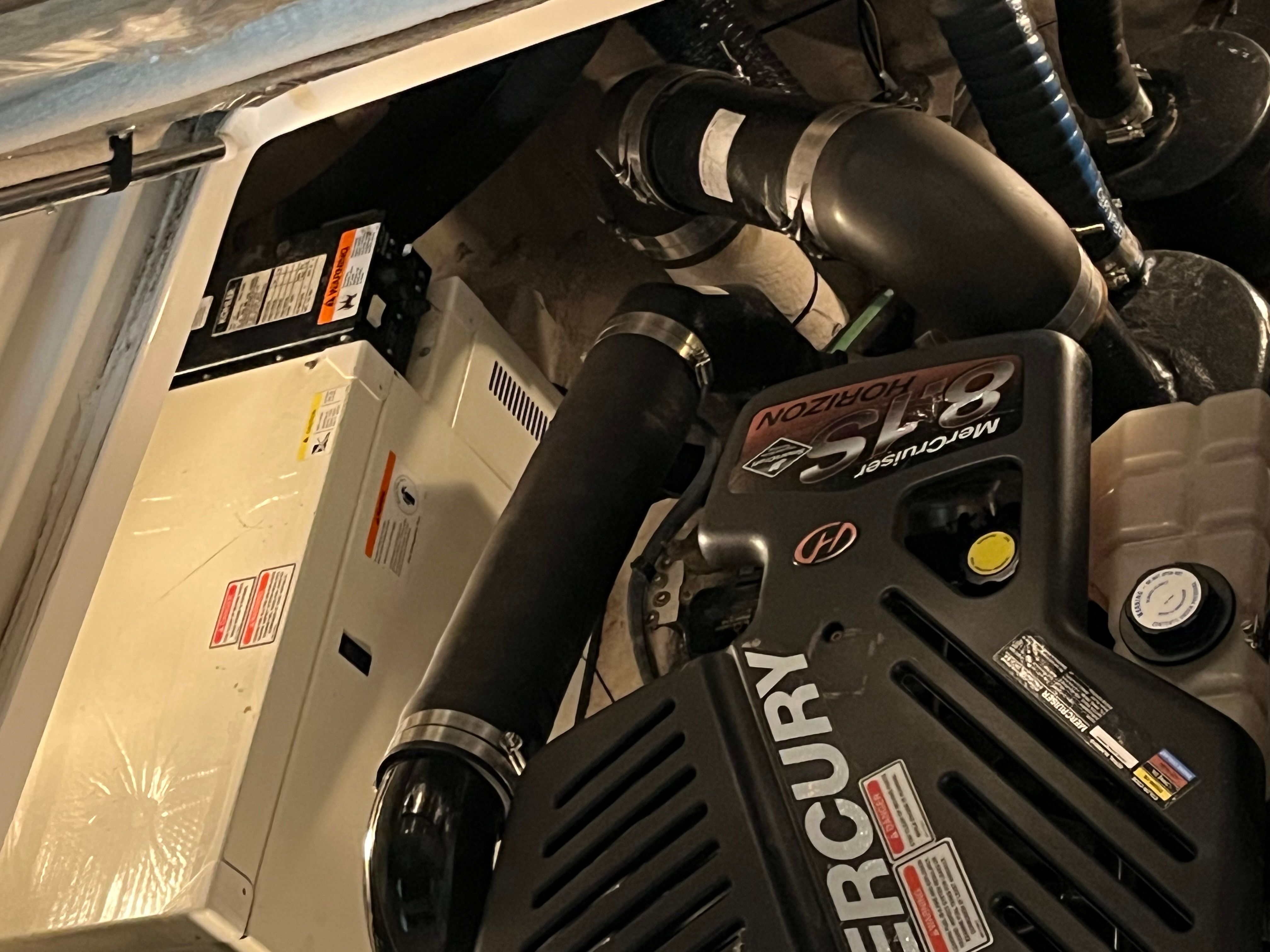 Engine compartment of a 2005 Sea Ray Sundancer boat with Mercury engine.