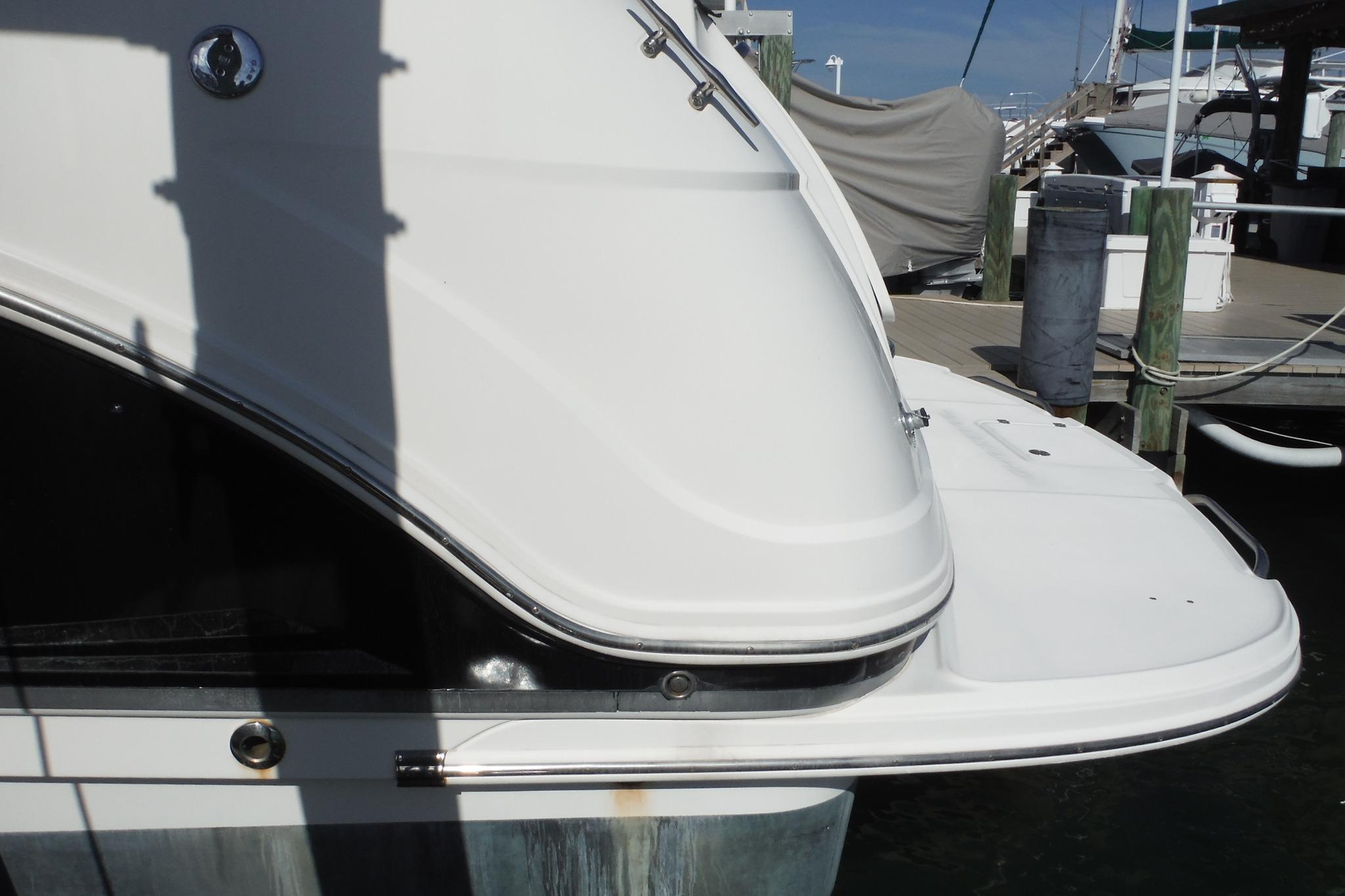 2005 Chaparral Signature 350 yacht docked at marina, rear view.