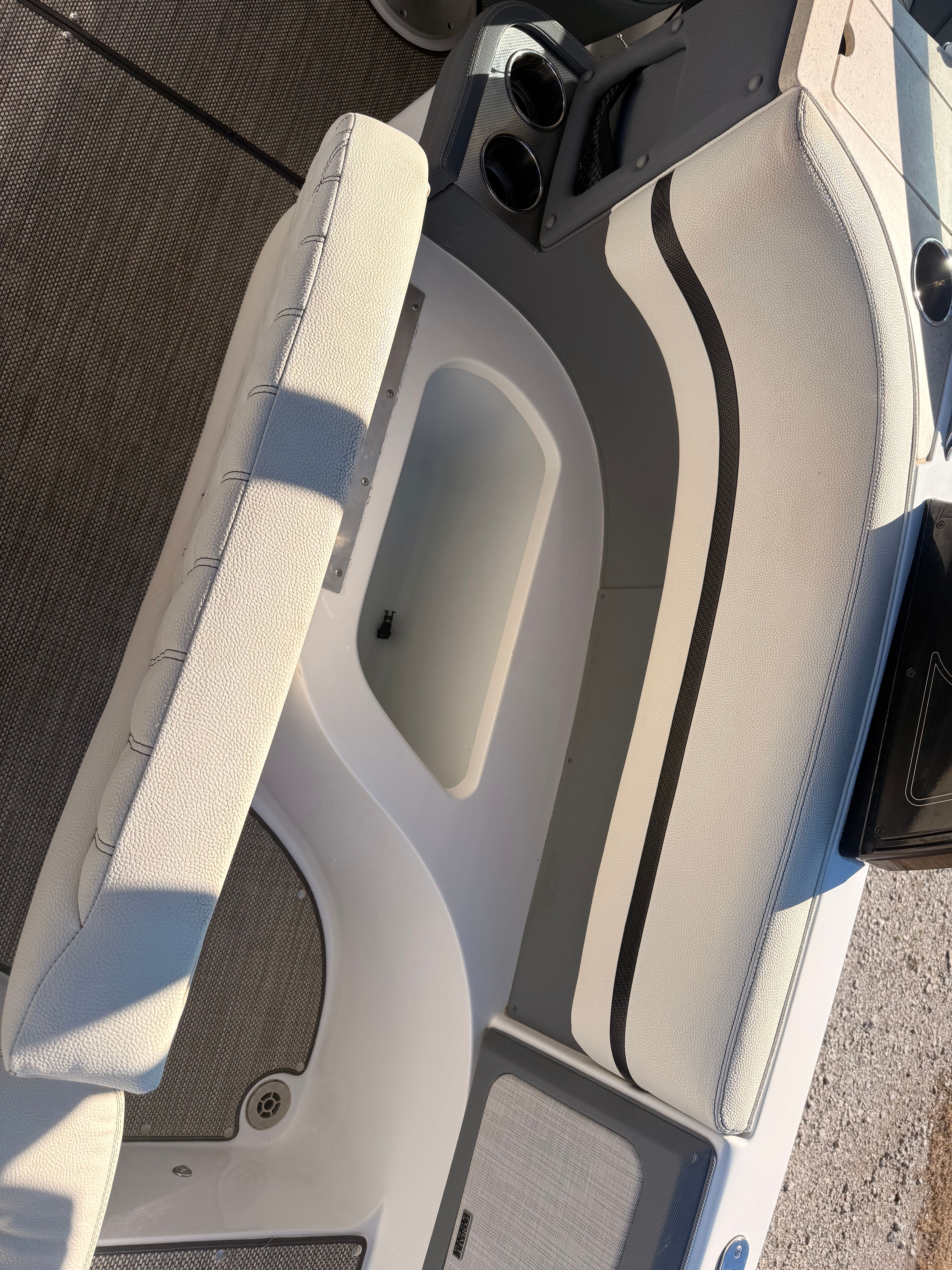 The image shows the cockpit of a 2019 Cobalt R7 Surf boat with white upholstery.
