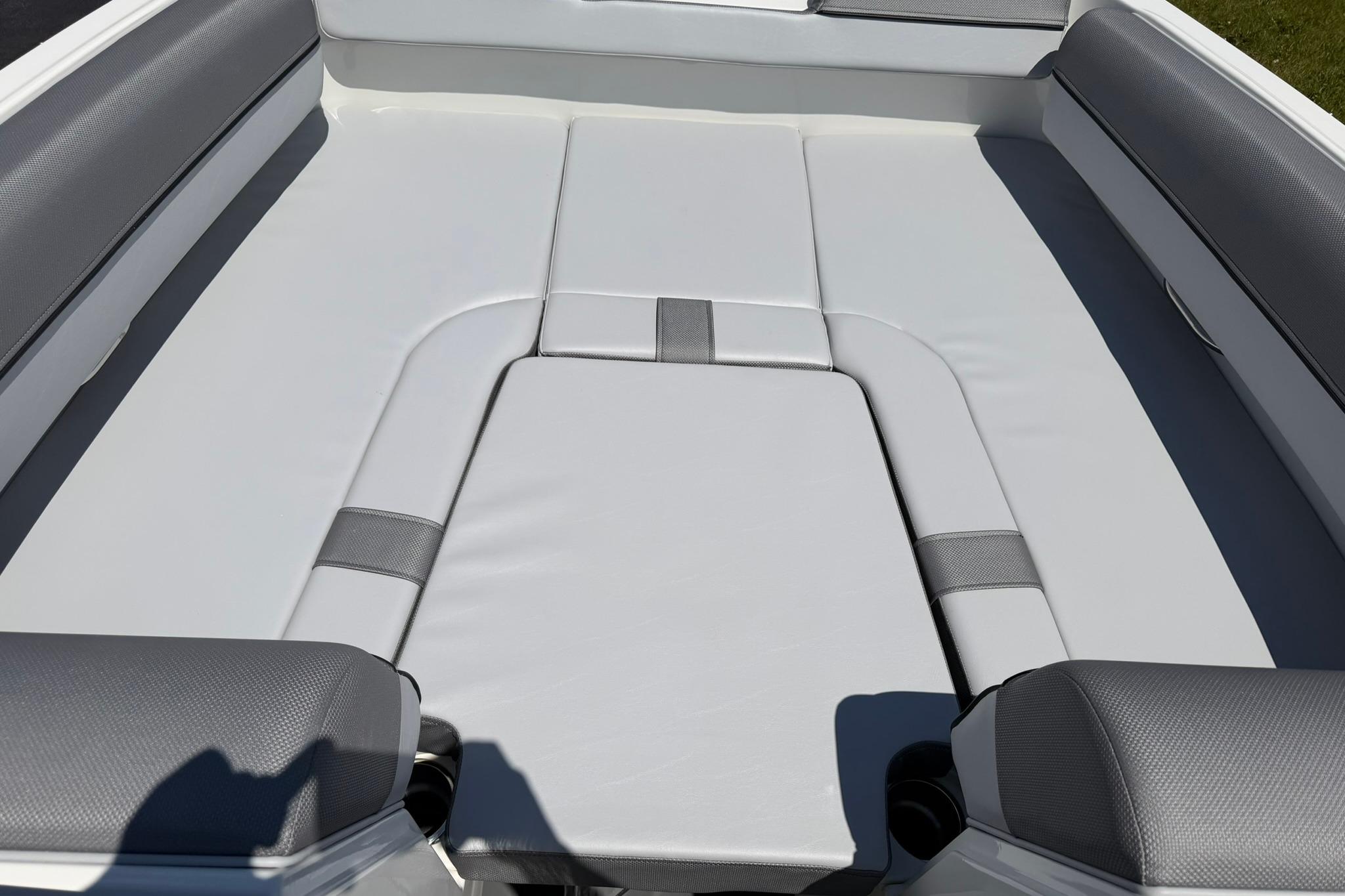 2026 Bayliner D20 boat interior with cushioned seating area.