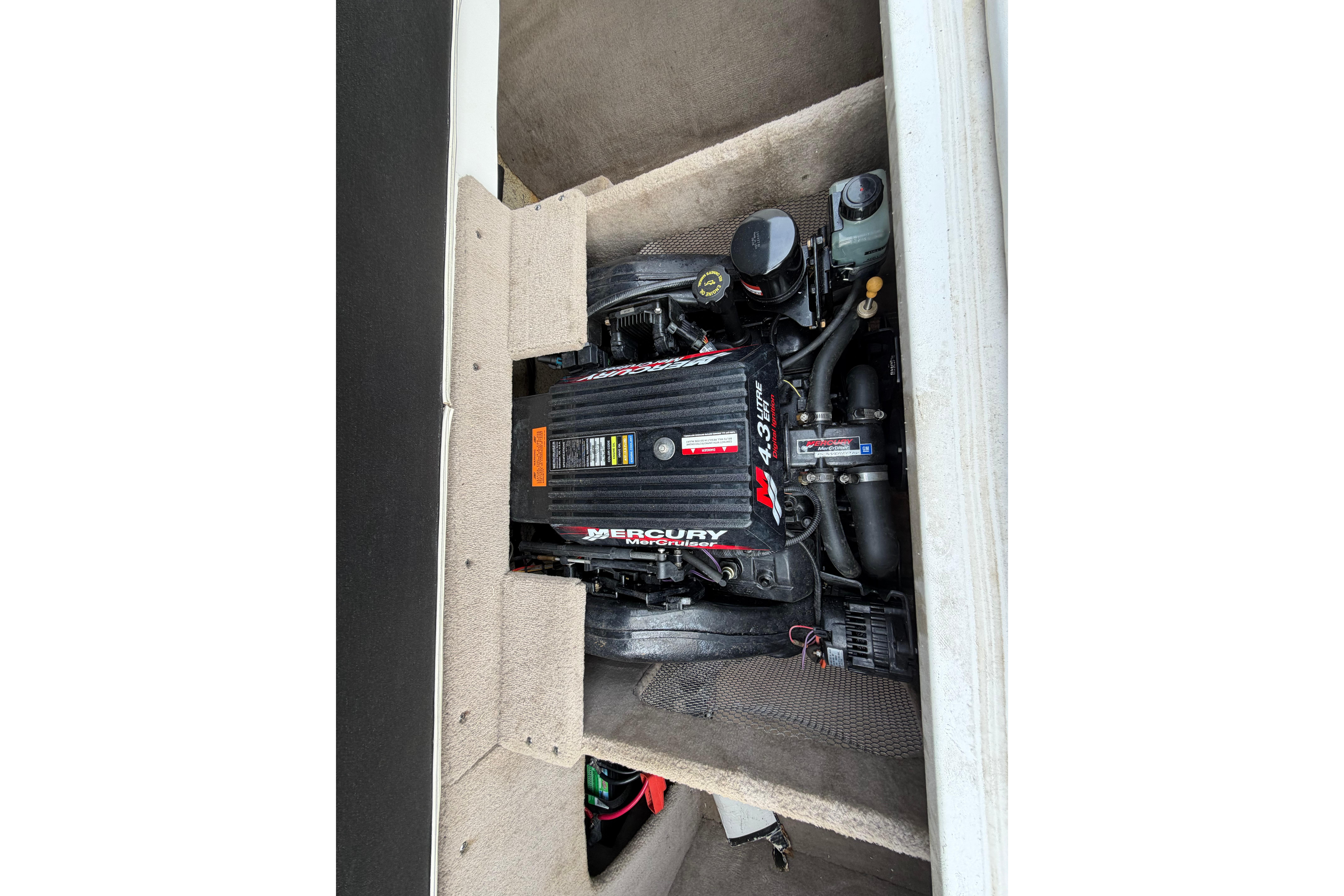 Engine compartment of a 2001 Ebbtide Campione 190 boat with Mercury motor.