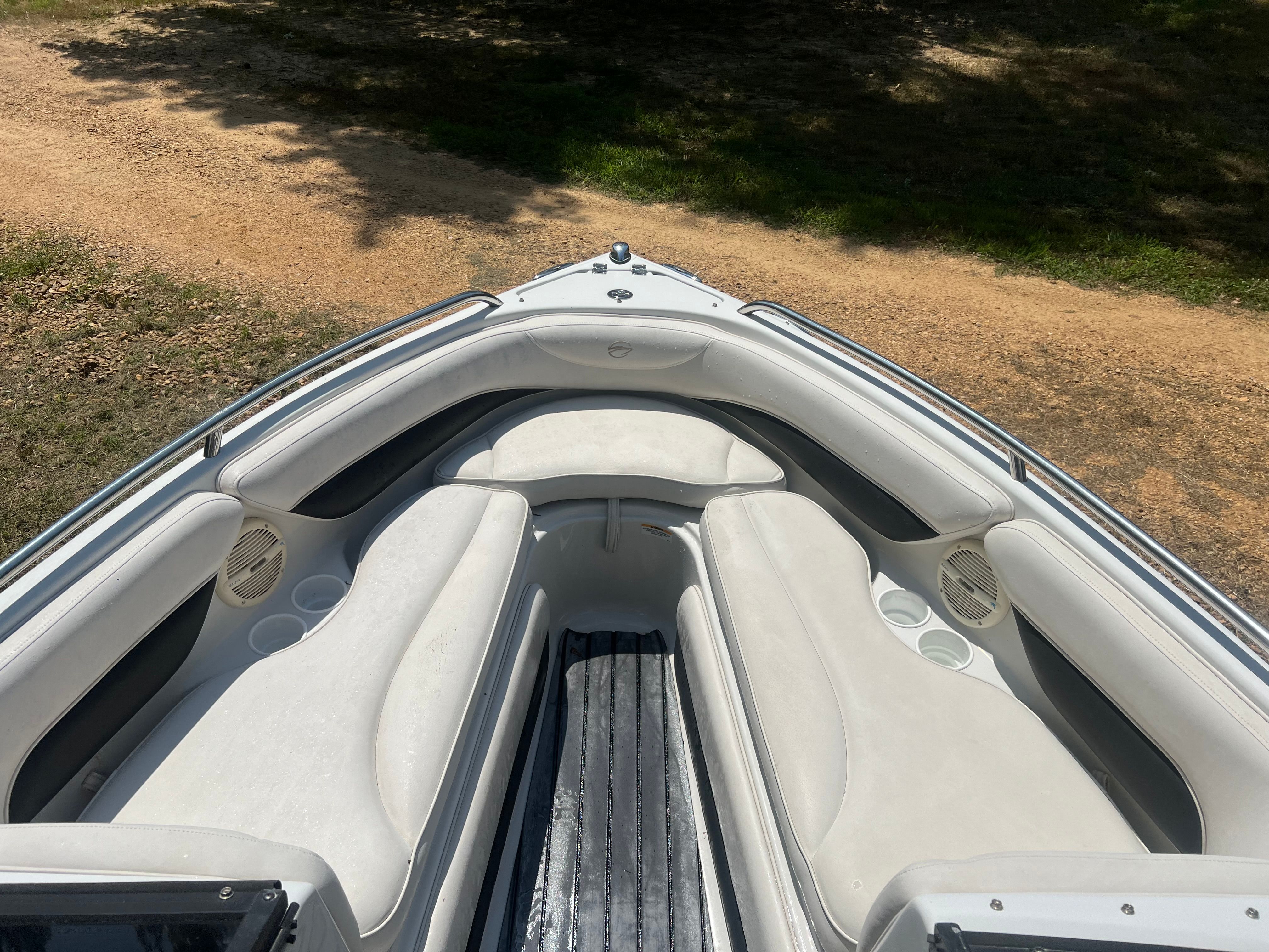 Interior view of a 2001 Crownline 202 BR boat with white seating.