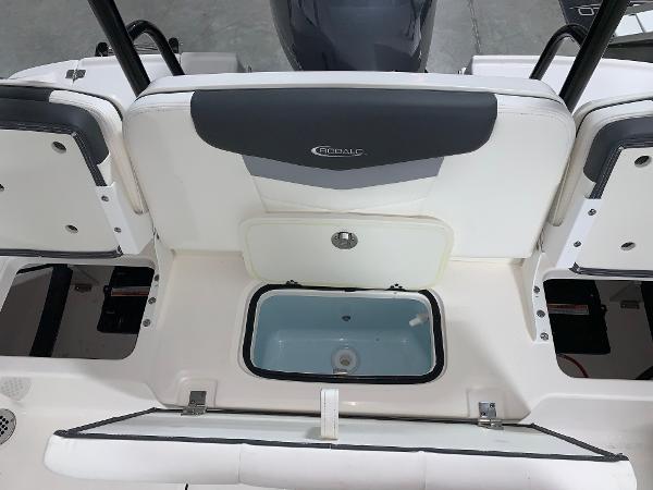 2024 Robalo R207 Dual Console boat interior with storage compartment.