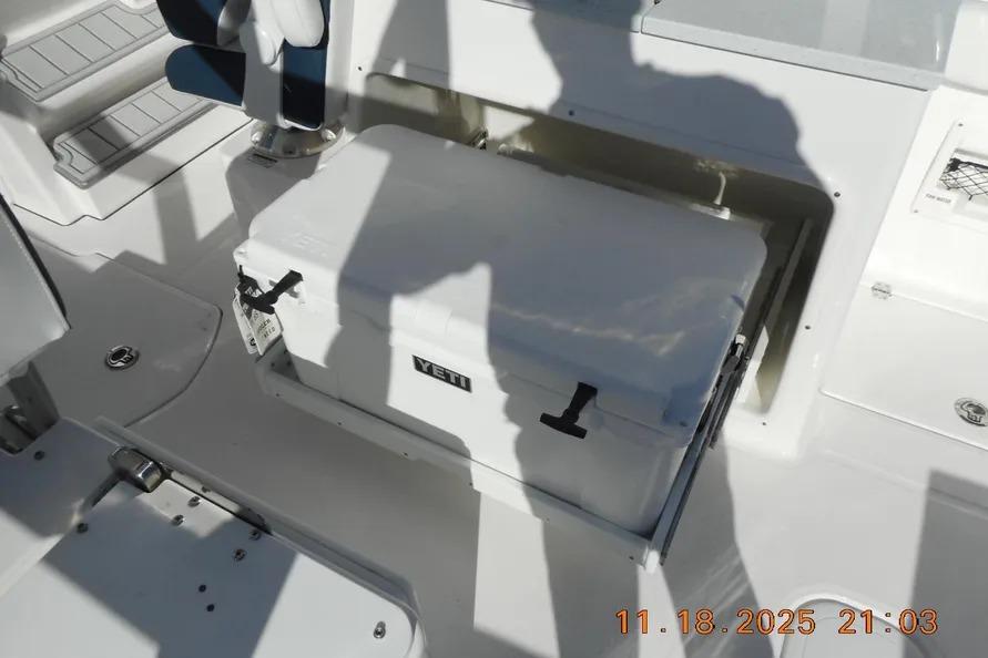 2026 Sea Fox 268 Traveler boat deck with Yeti cooler and seating area.