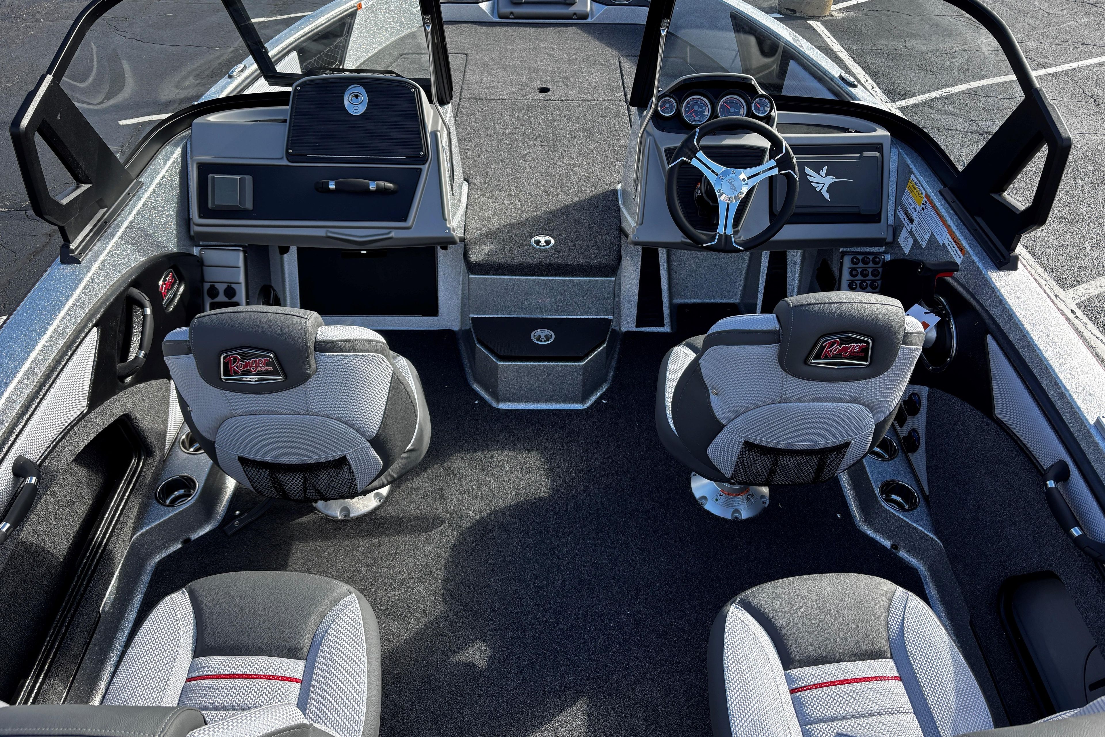 Interior of a 2026 Ranger 1880MS boat featuring modern seating and dashboard design.