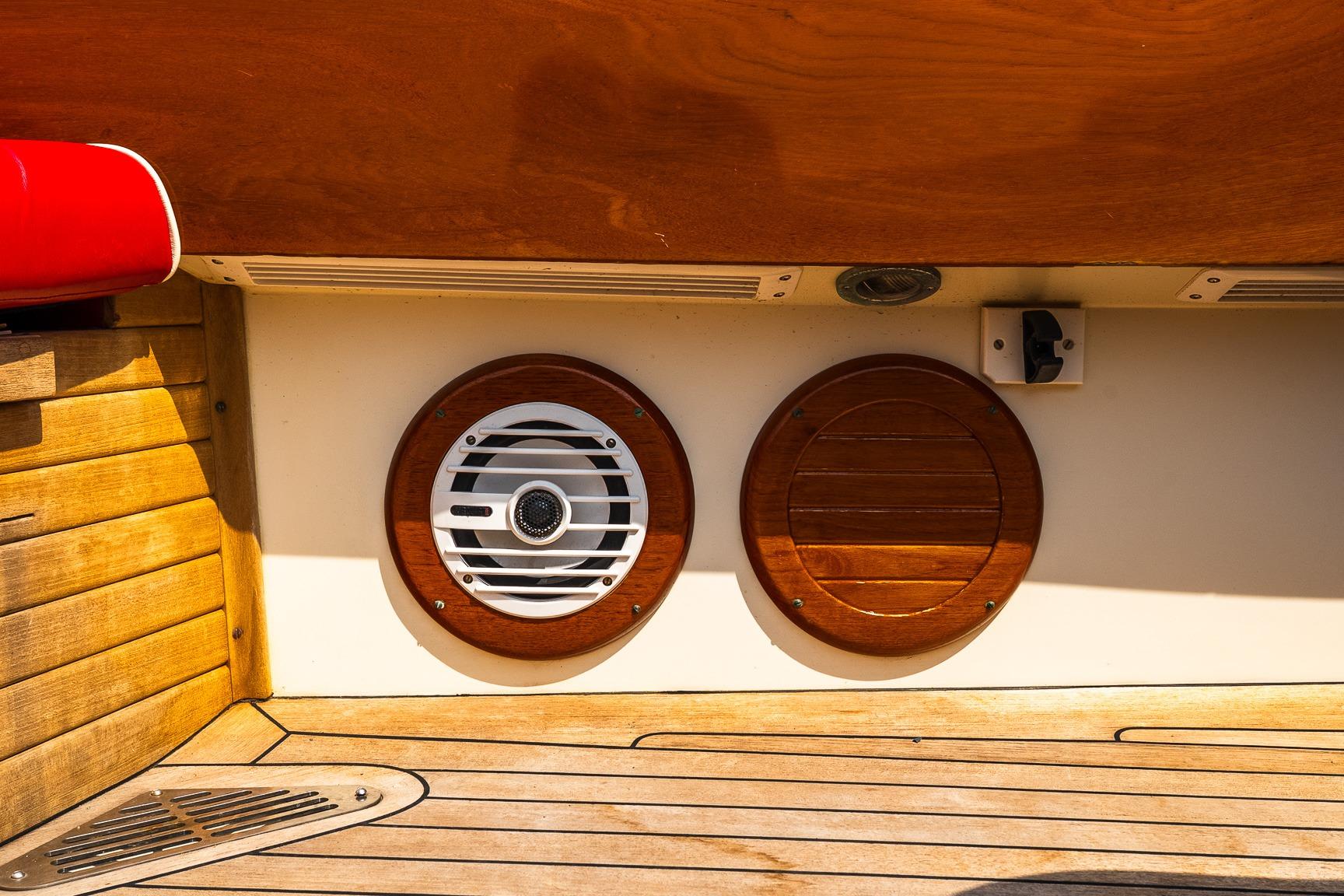 Hinckley Talaria 29R 2005 boat interior with wooden accents and speaker detail.
