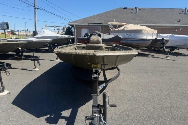 2026 Tracker Grizzly 1860 CC boat on trailer in outdoor lot.