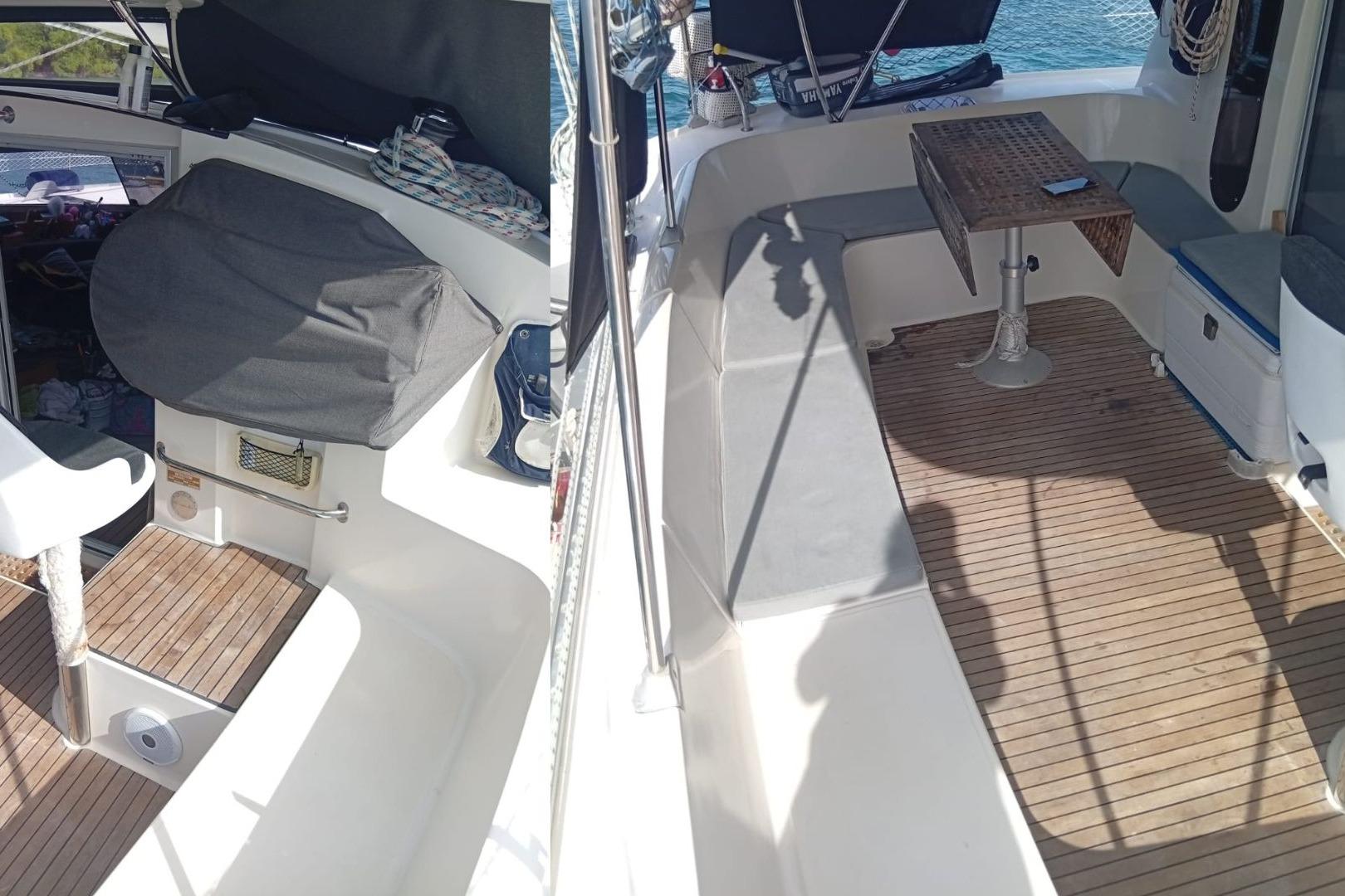 1996 Fountaine Pajot Athena 38 catamaran cockpit with seating and table, featuring teak flooring.