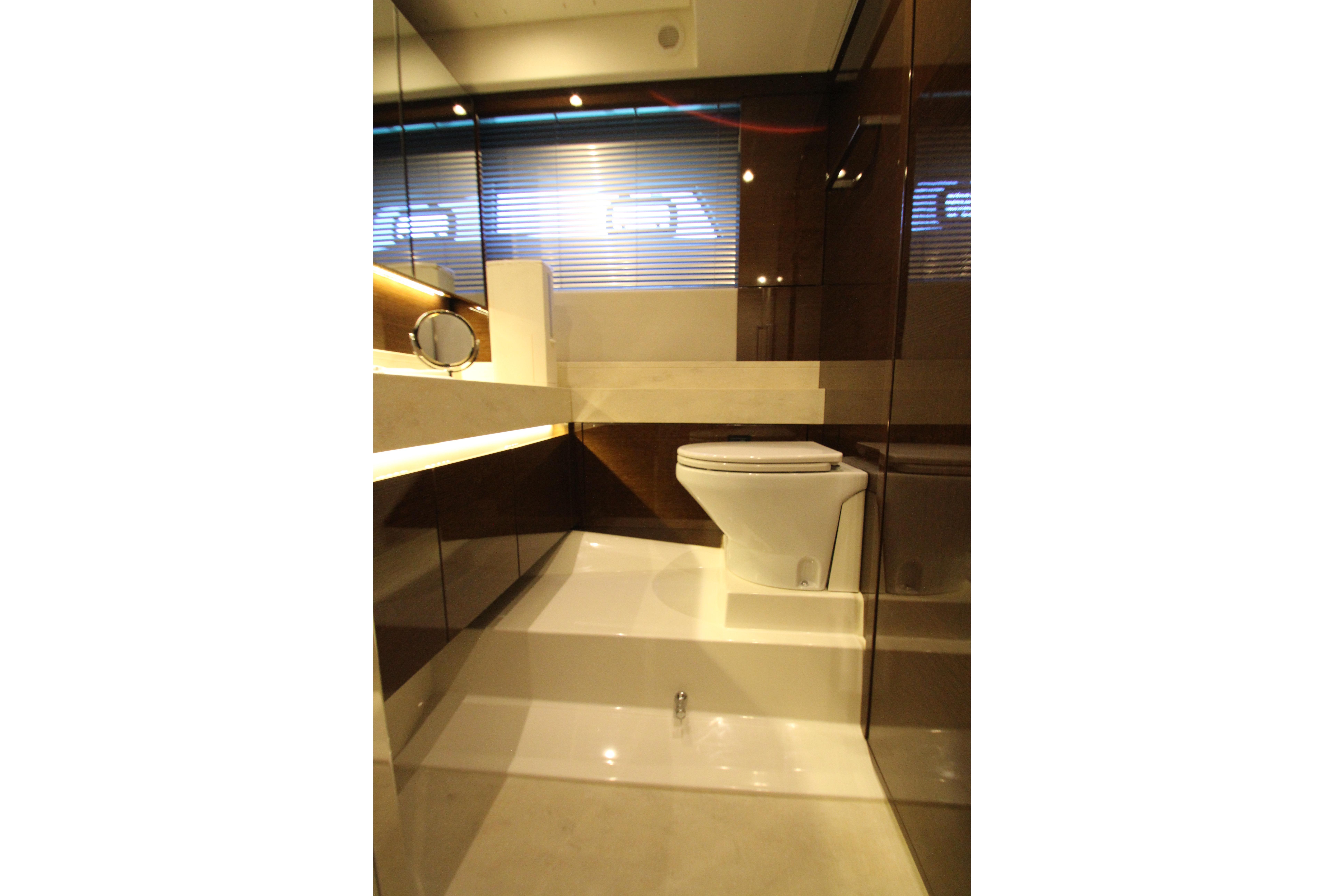 Luxurious bathroom interior on a 2022 Prestige 520 yacht, featuring modern fixtures and sleek design.