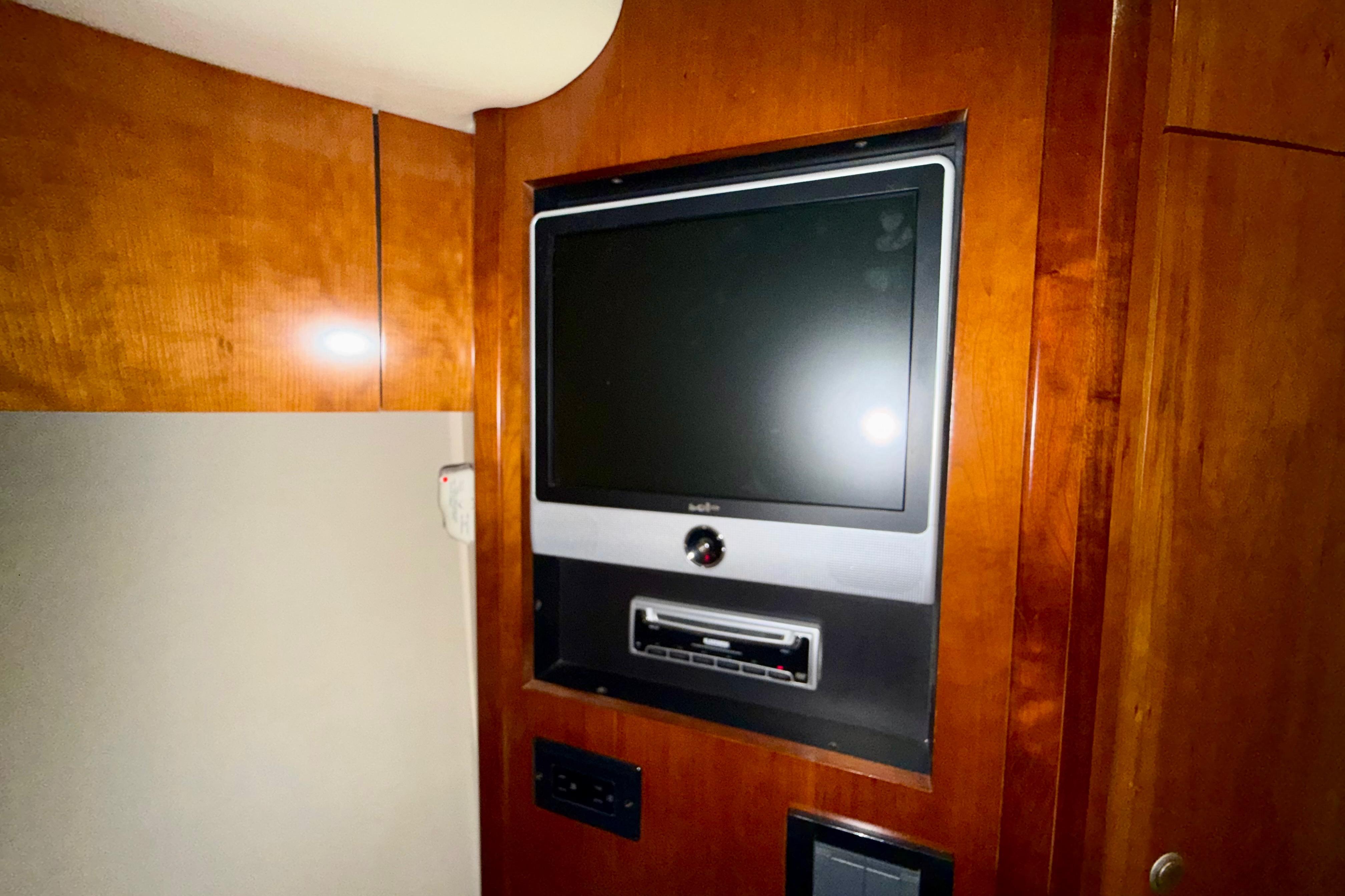 Interior of 2011 Cruisers Yachts 390 Sports Coupe with built-in entertainment system.