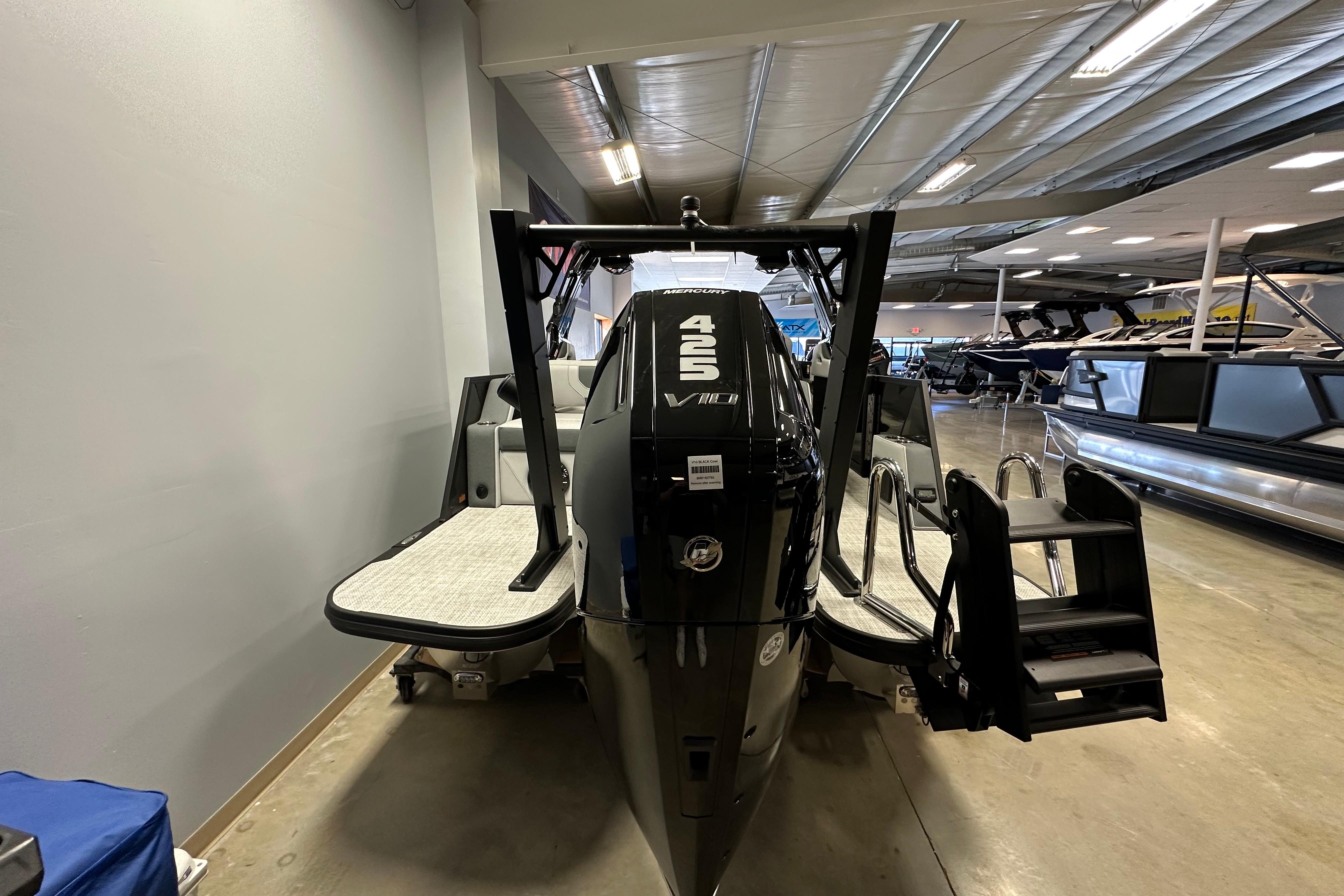 2026 Alera M25L boat with powerful 425 engine displayed in showroom.