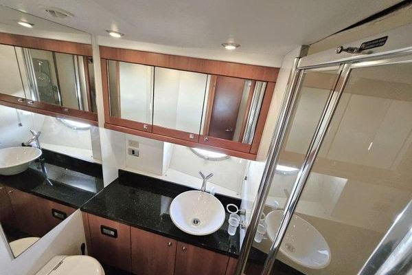 Luxurious bathroom in 2005 Sunseeker Manhattan 66 yacht with modern fixtures and elegant design.