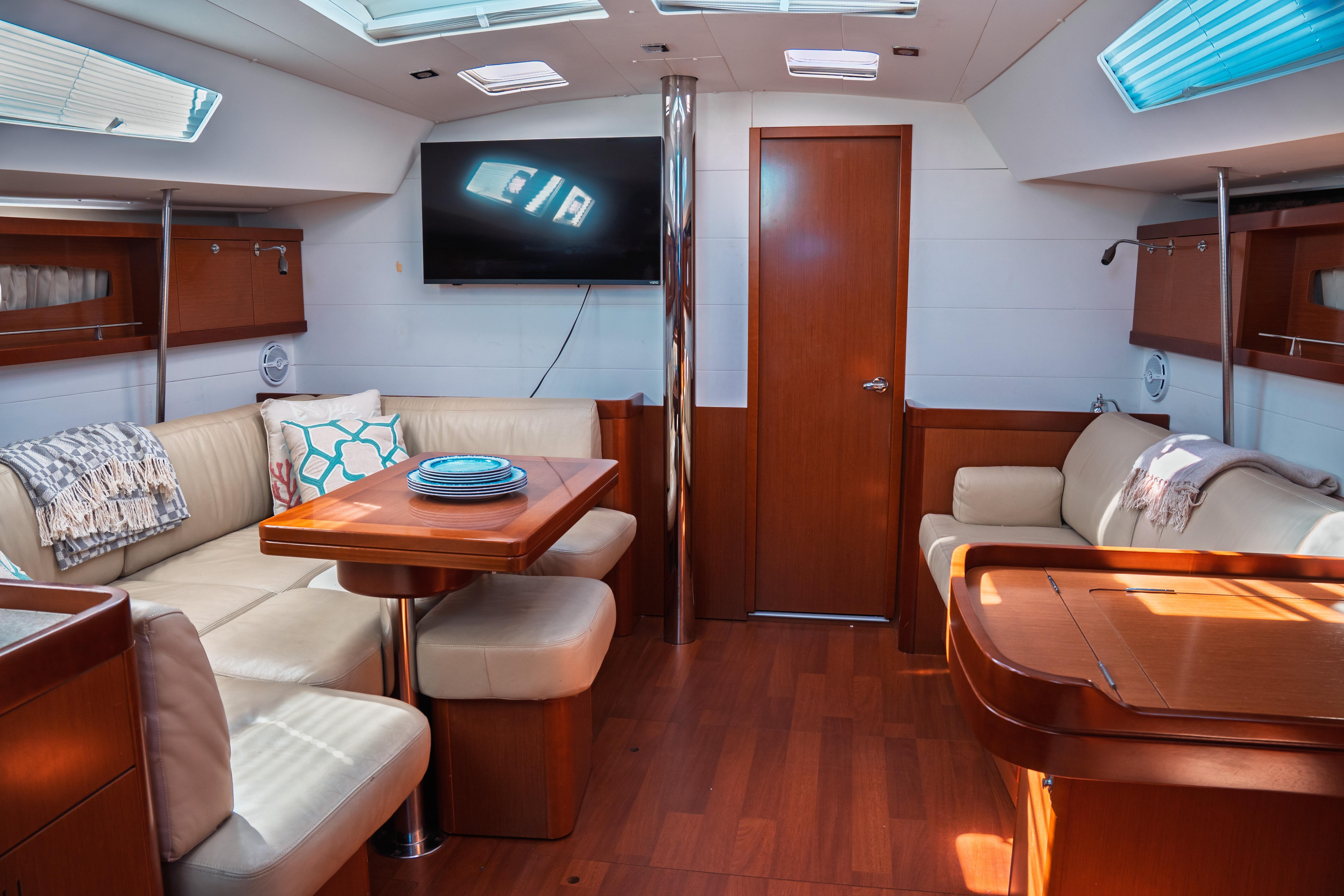 Luxurious interior of 2011 Beneteau Oceanis 50 yacht with elegant seating and modern amenities.