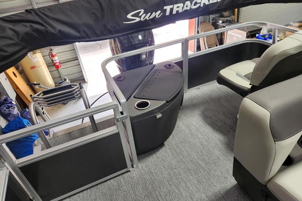 2026 Sun Tracker Bass Buggy 18 DLX interior with seating and storage features.
