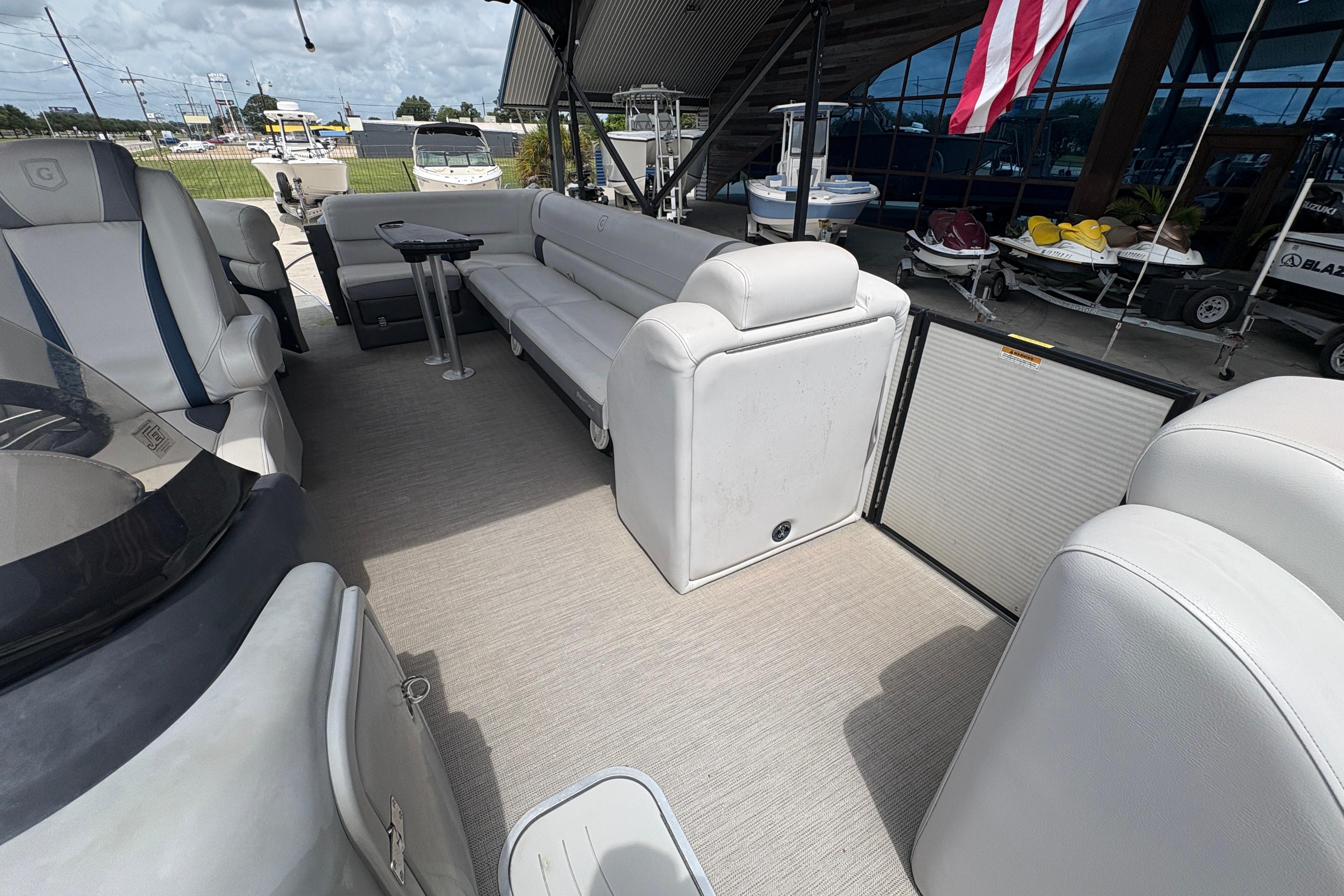 2019 Godfrey Aqua Patio boat interior with white seating and modern design.
