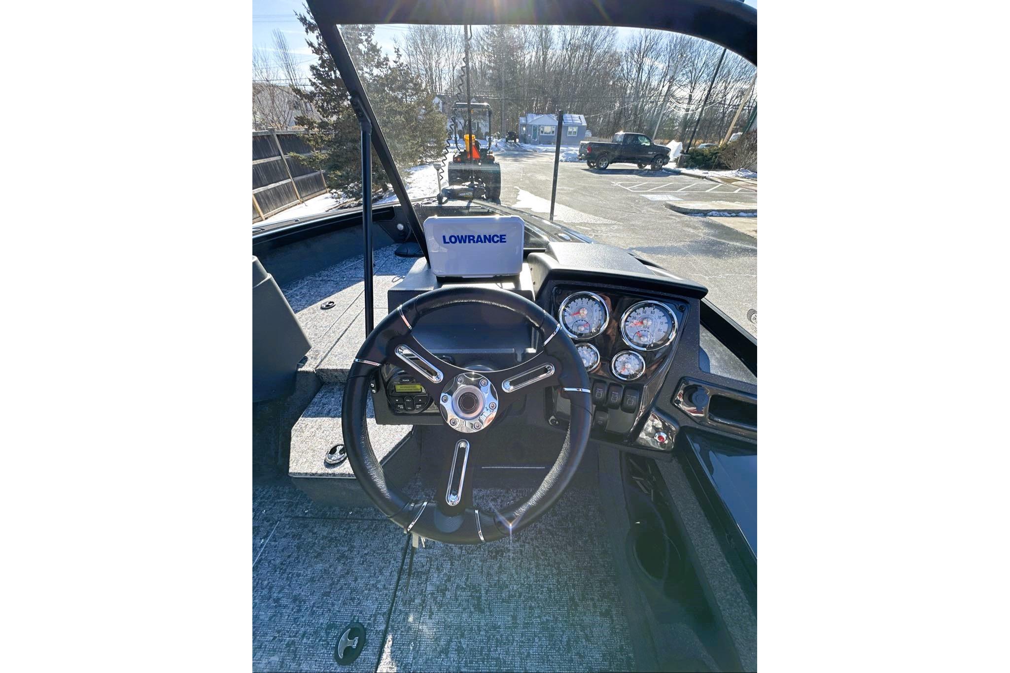 2026 Tracker Targa V-19 WT boat dashboard with steering wheel and gauges.