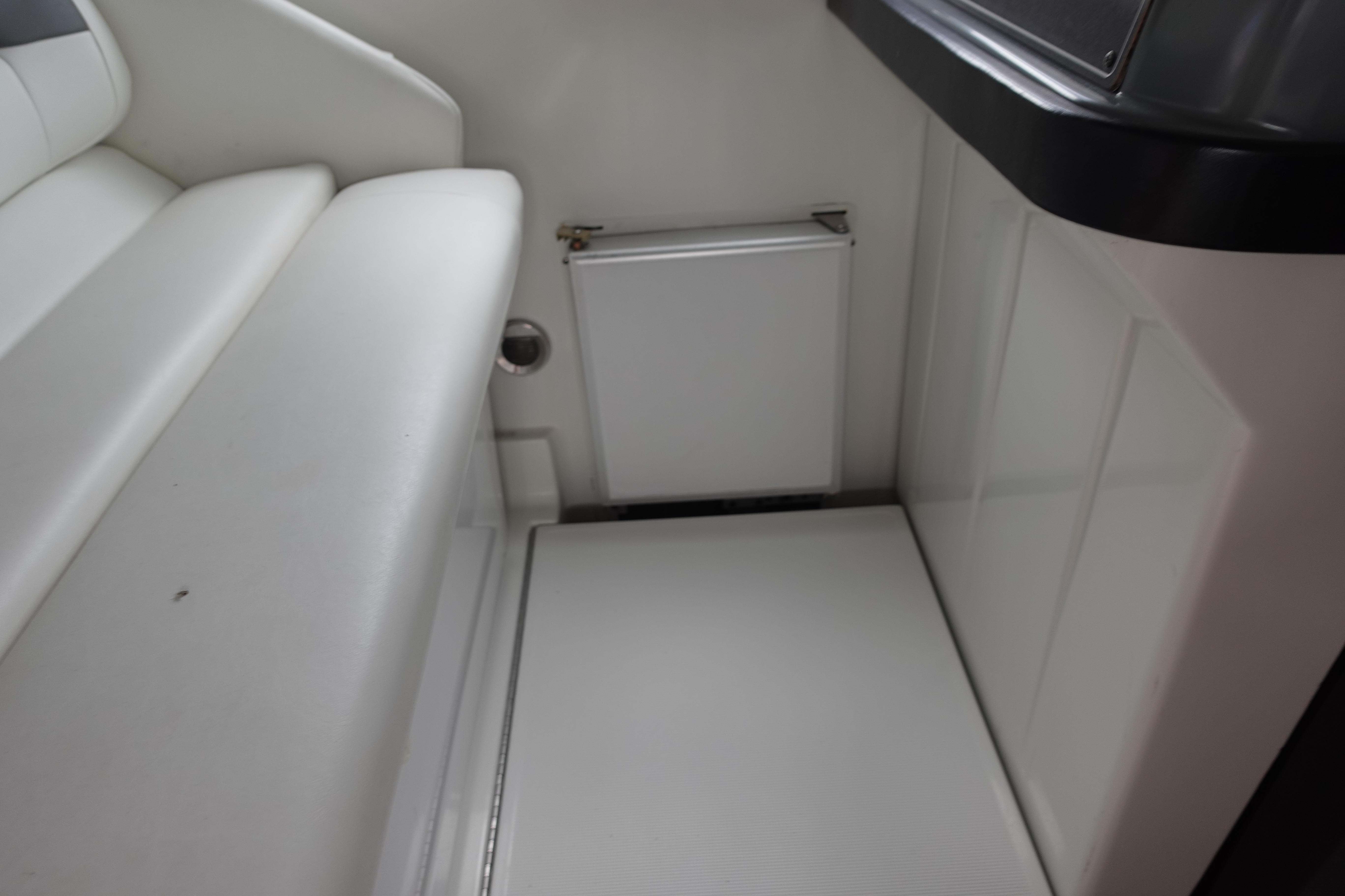 1993 Formula 34 Performance Cruiser interior with white seating and compact storage area.