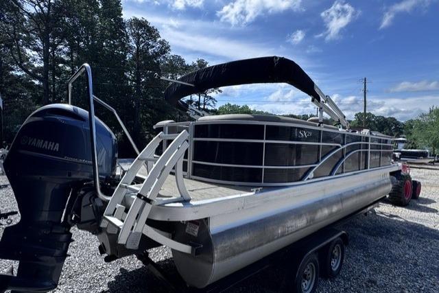 2021 Bennington 23 SSRX pontoon boat on trailer with Yamaha outboard motor.