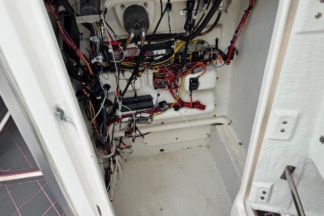 Interior wiring of a 2015 Robalo 226 Cayman boat, showcasing complex electrical setup.