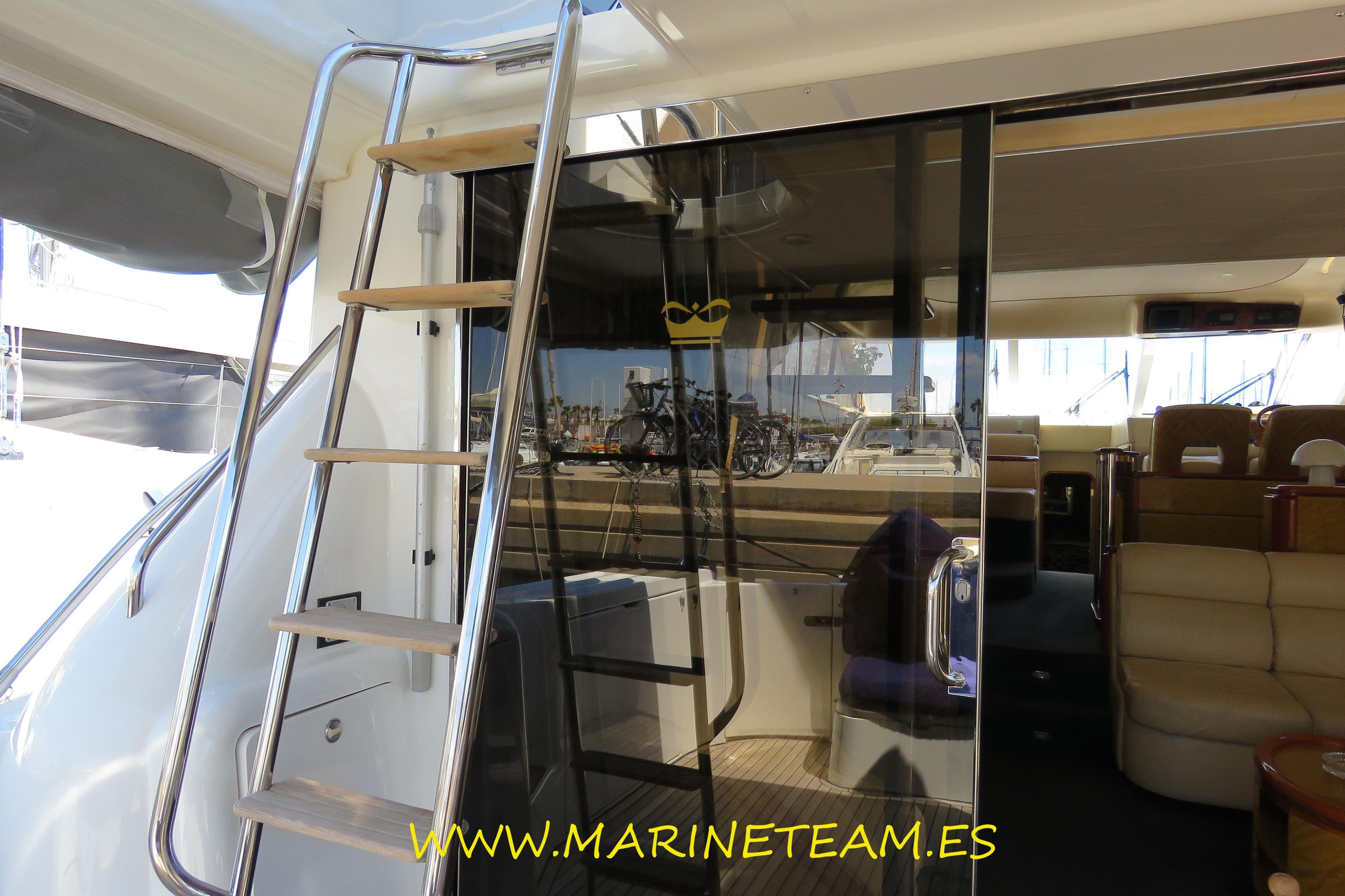 Interior view of a 1995 Princess 60 yacht with a ladder and seating area.