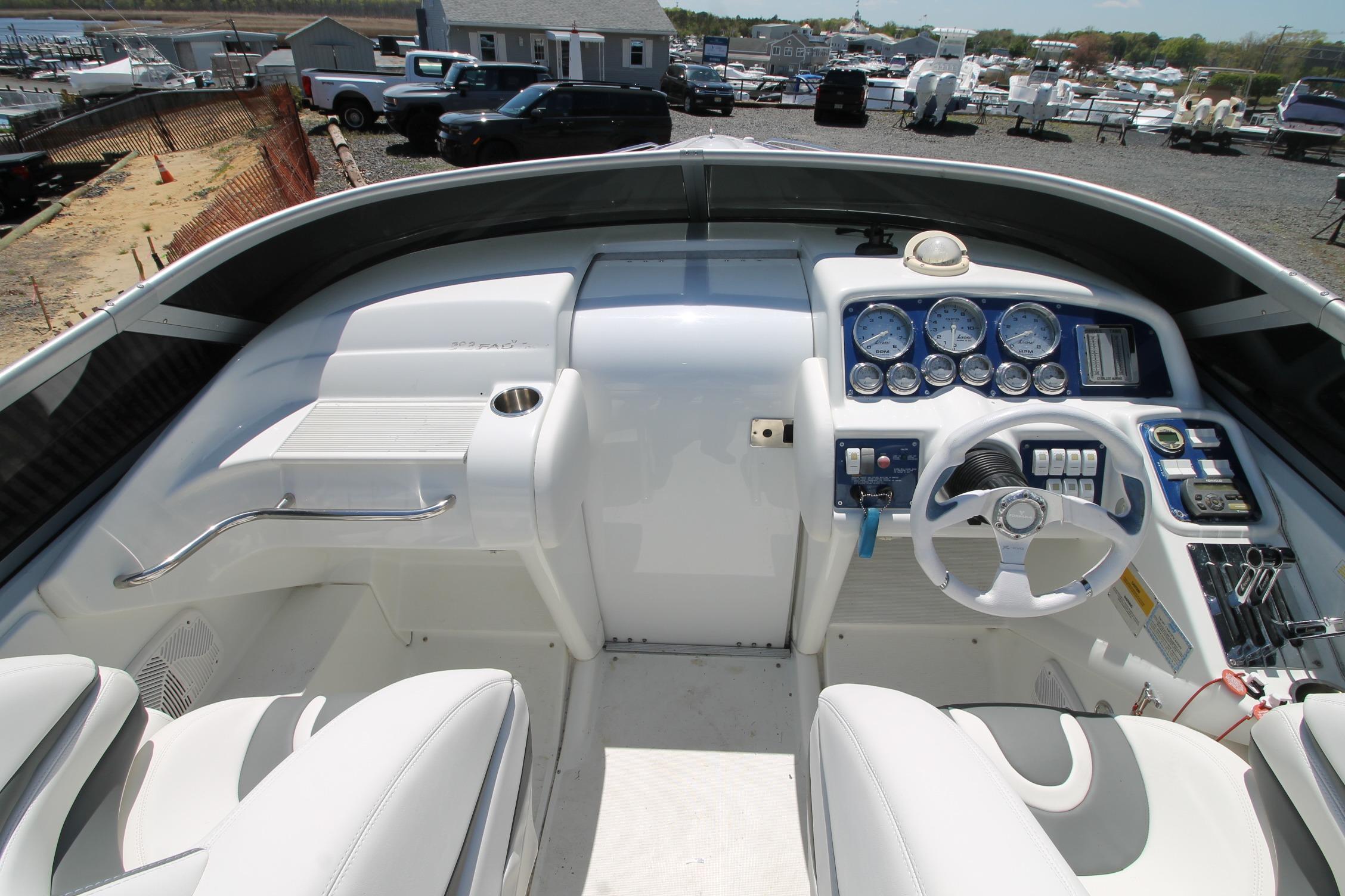 2006 Formula 292 FASTech boat cockpit with steering wheel and instrument panel.
