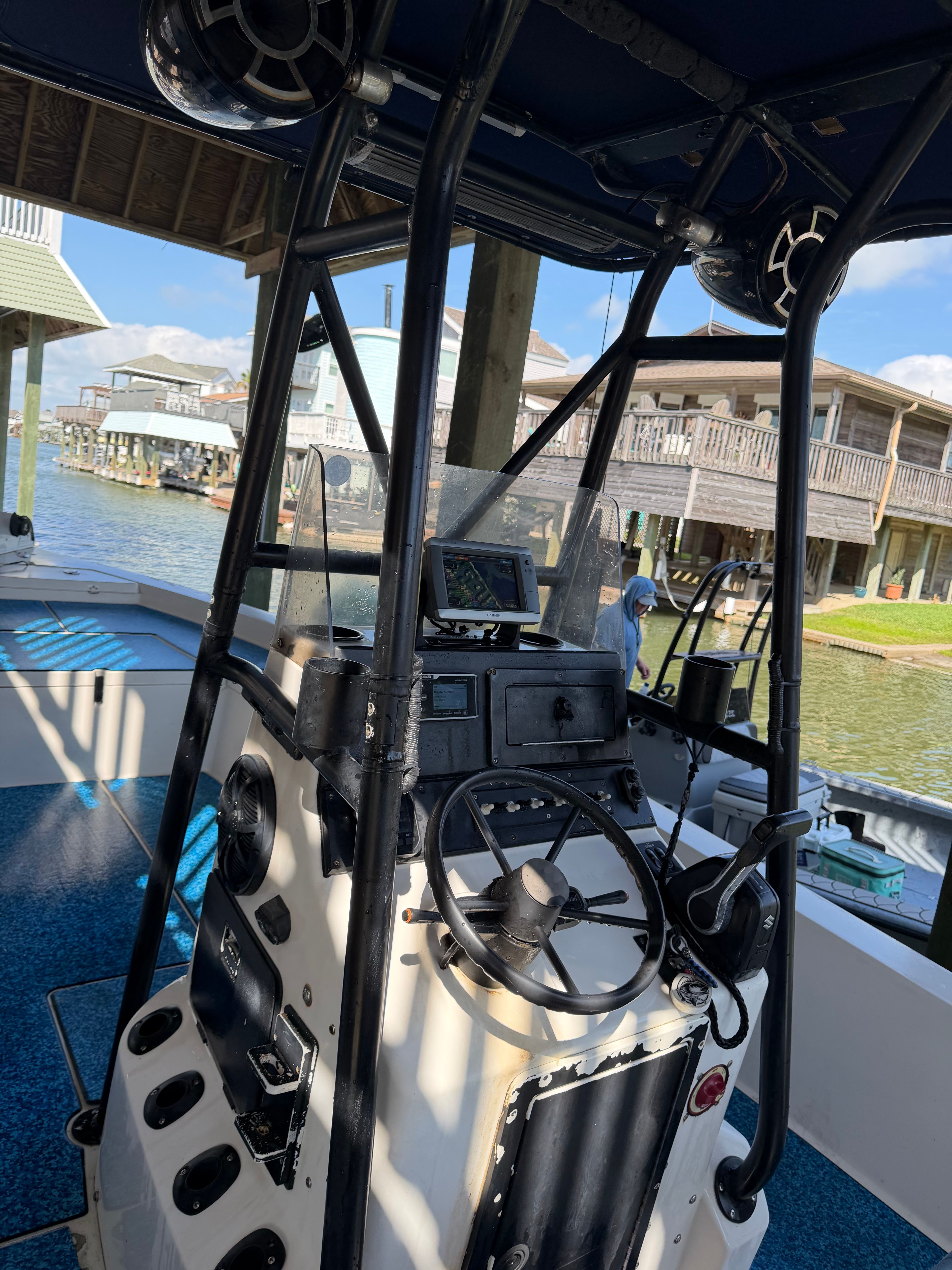 The interior of a Pathfinder boat with steering console and electronics.