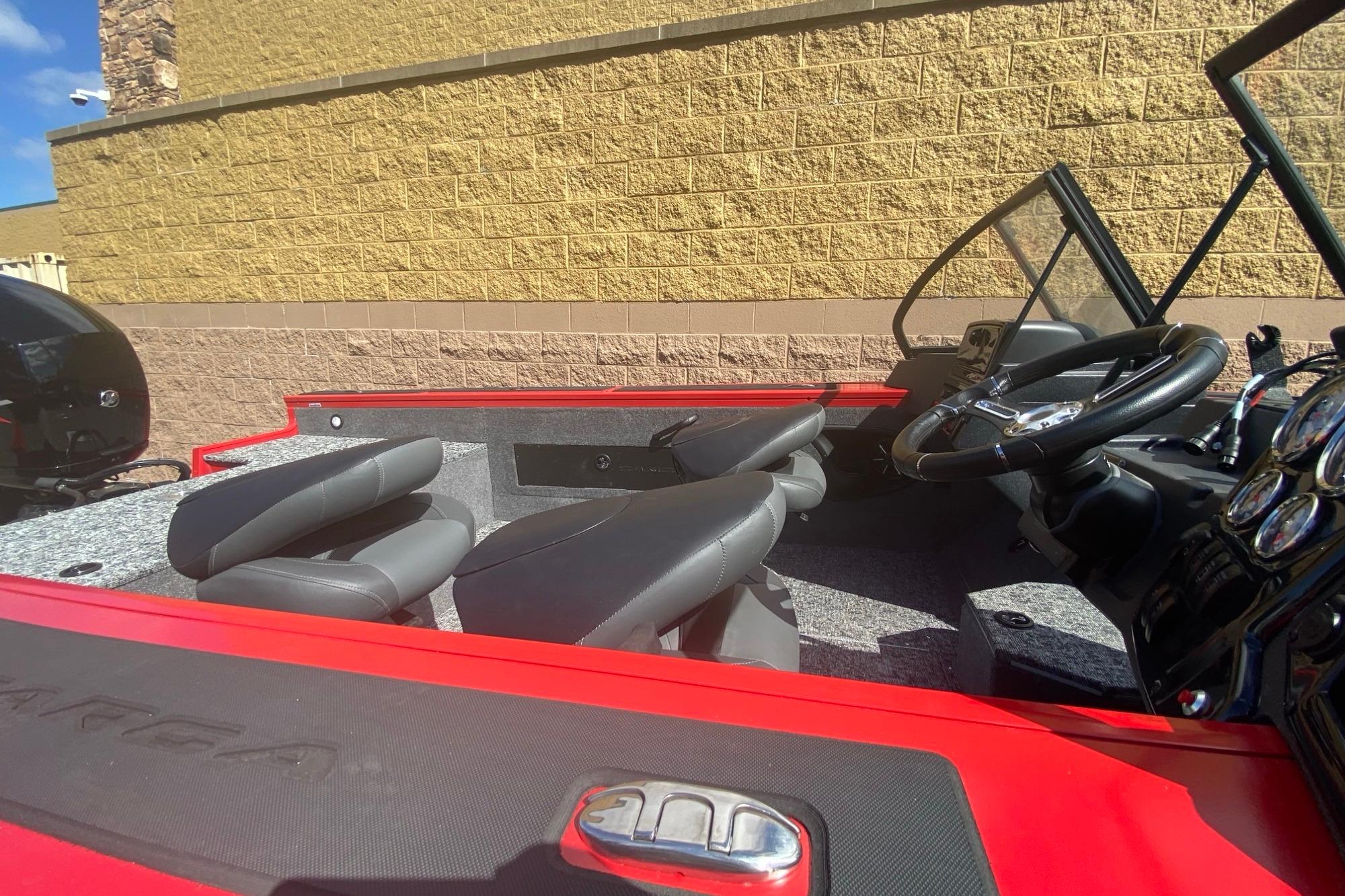 2026 Tracker Targa V-18 WT boat interior with steering wheel and seating.