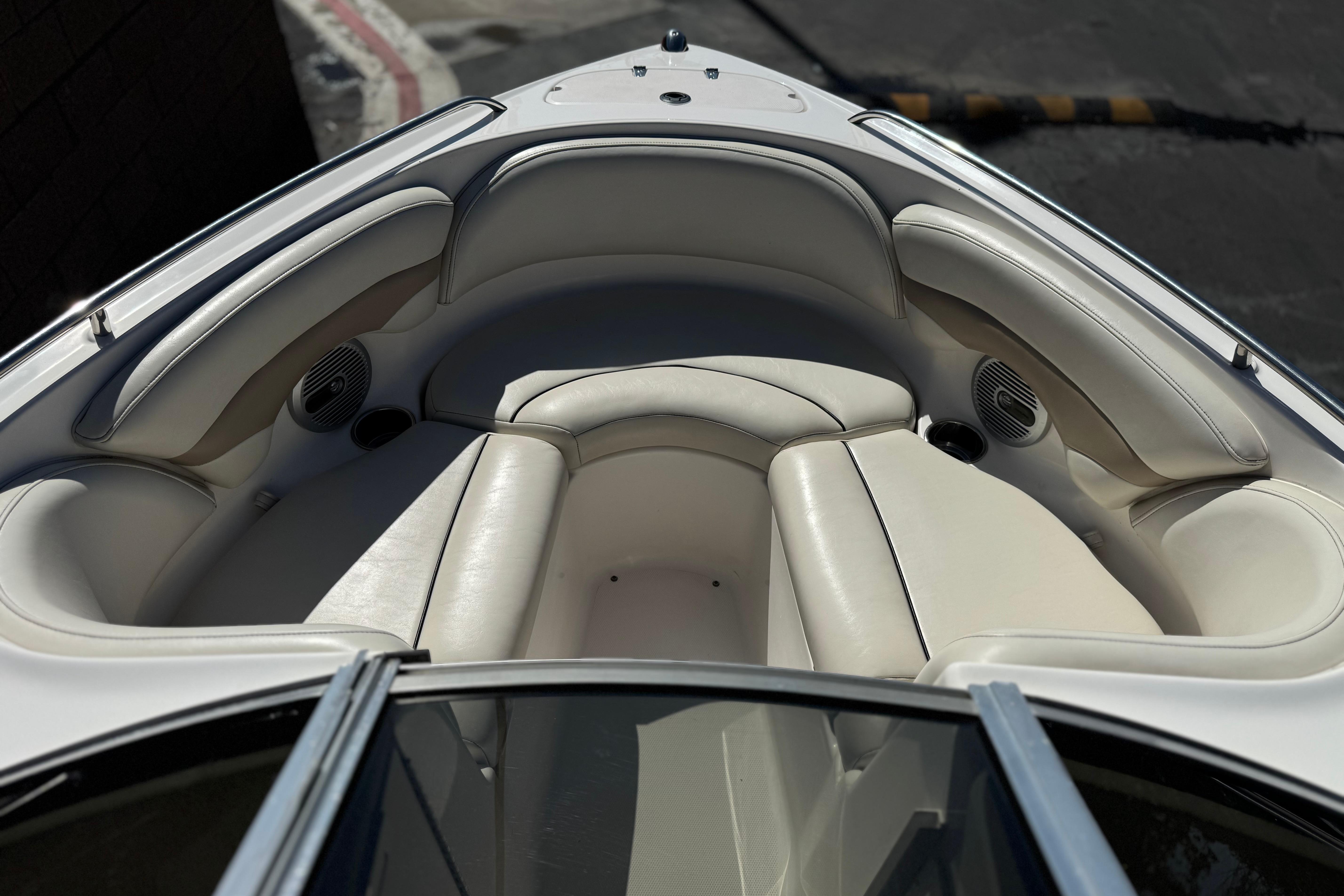 Interior view of 2002 Chaparral 186 SSi boat with white cushioned seating.