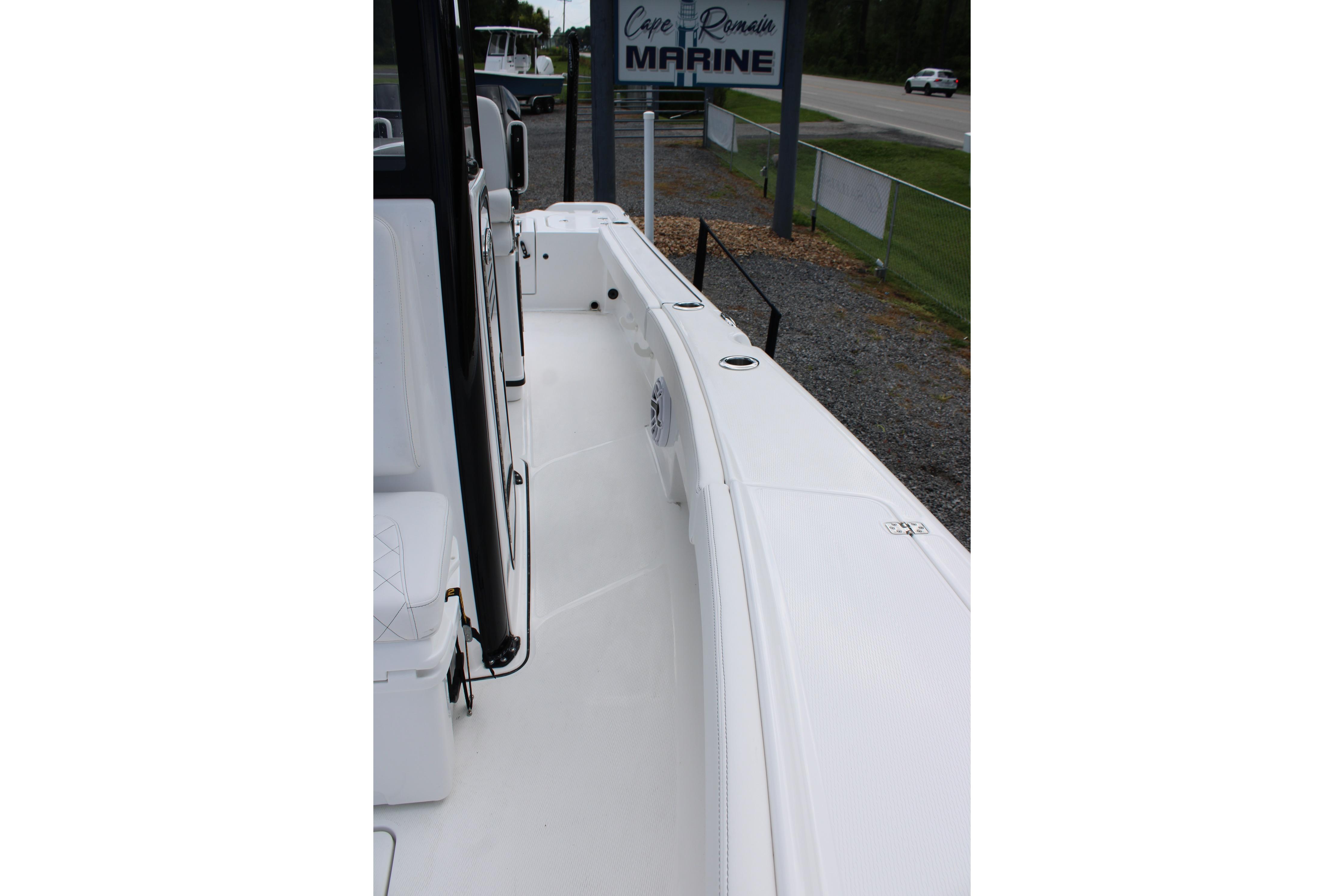 2027 Blazer Bay Makaira 2800 boat deck, sleek design, parked at marine dealership.