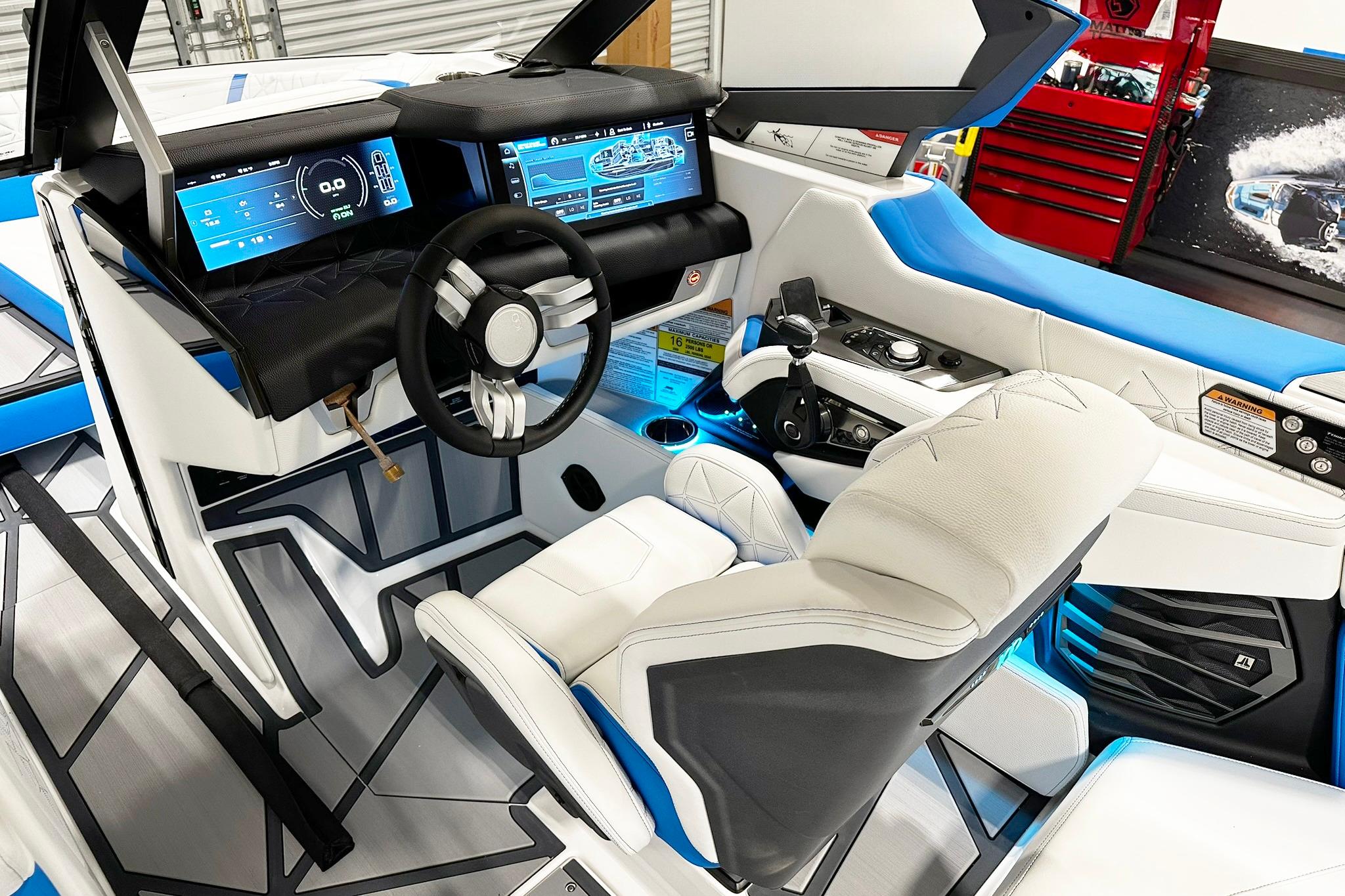 2025 Nautique Super Air Nautique G23 Paragon cockpit with advanced digital displays and luxurious seating.