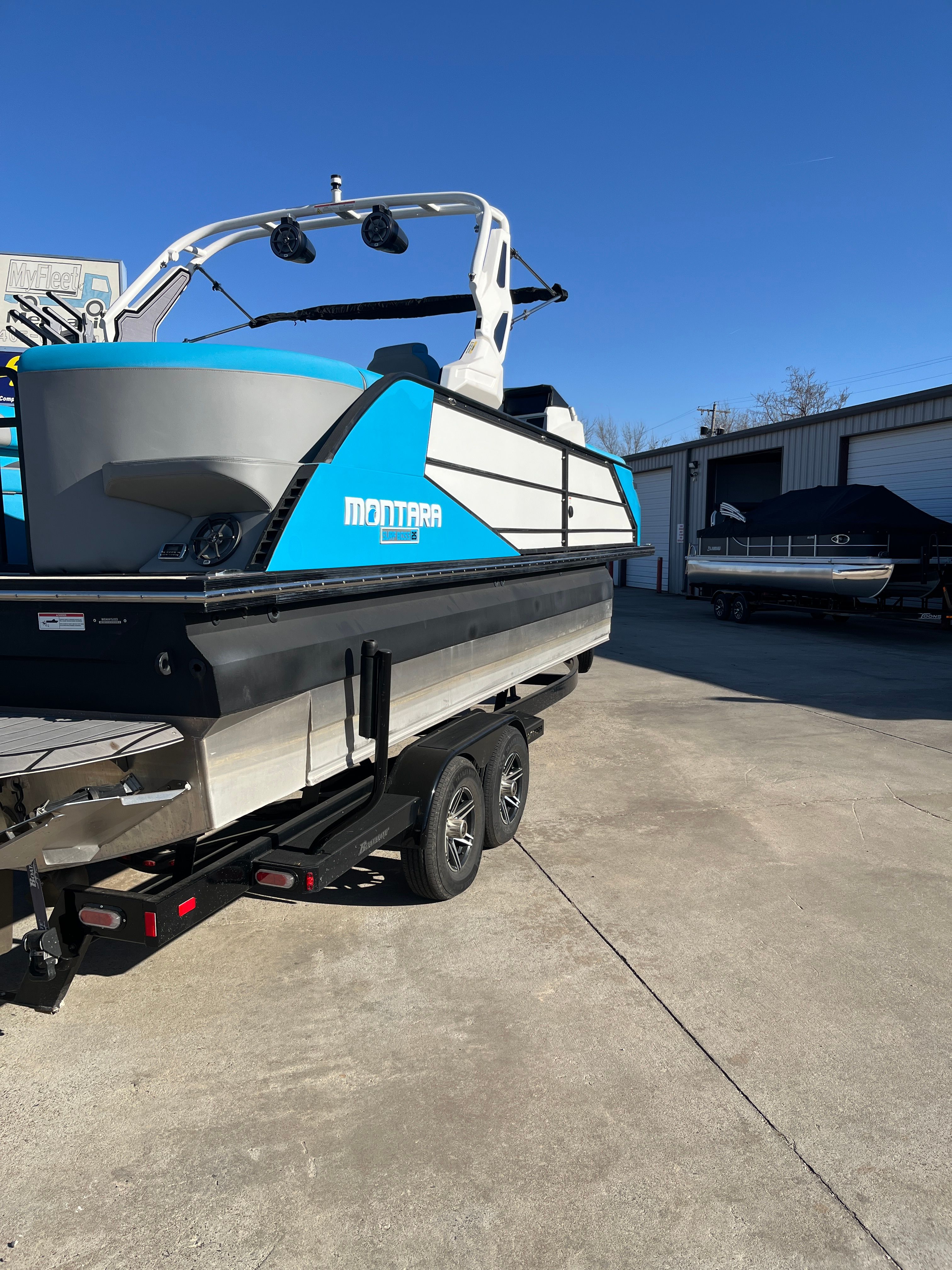 2023 Montara Surf Boss 2.0 boat on trailer outdoors.